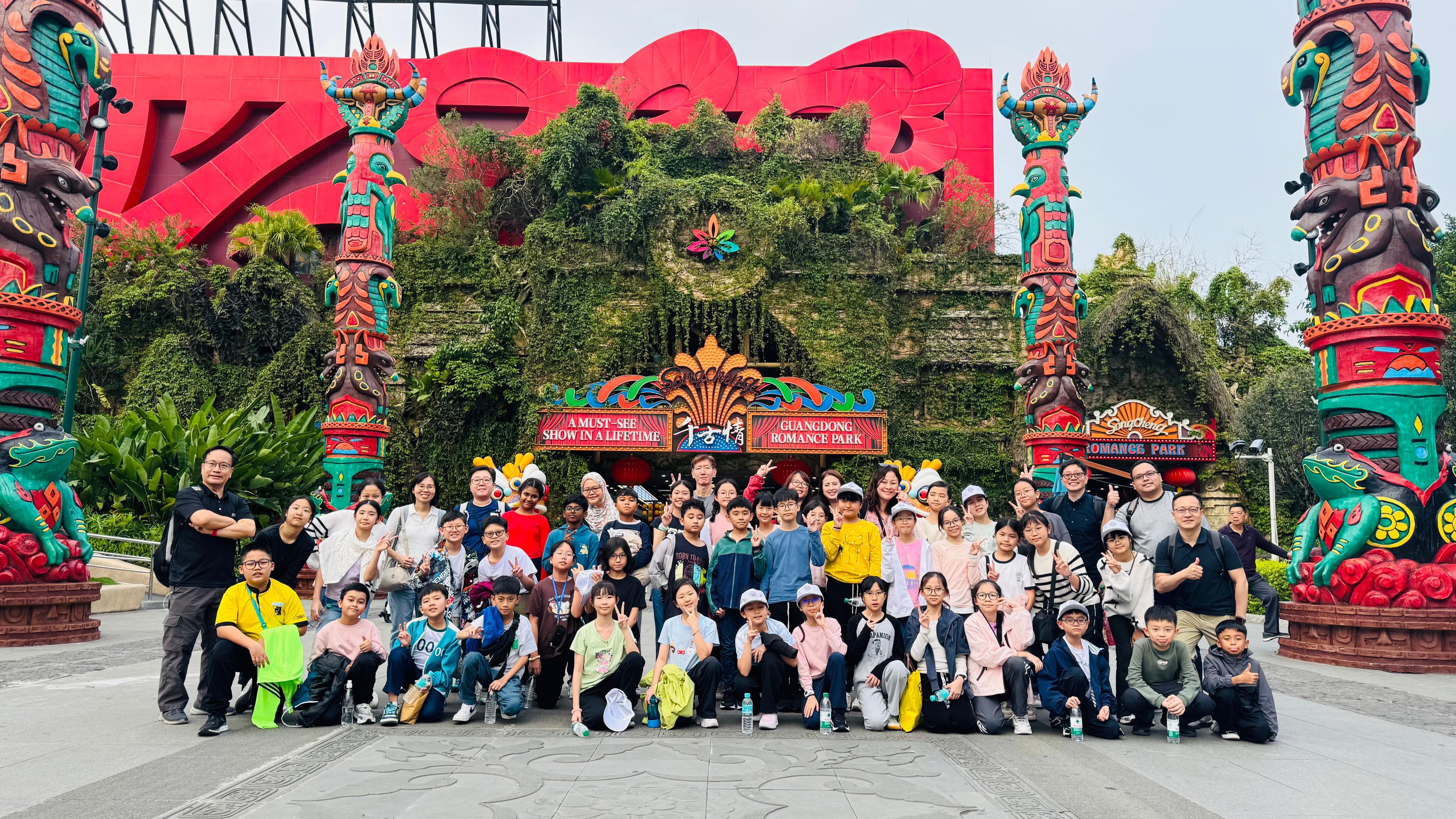Students posing at a cultural attraction.