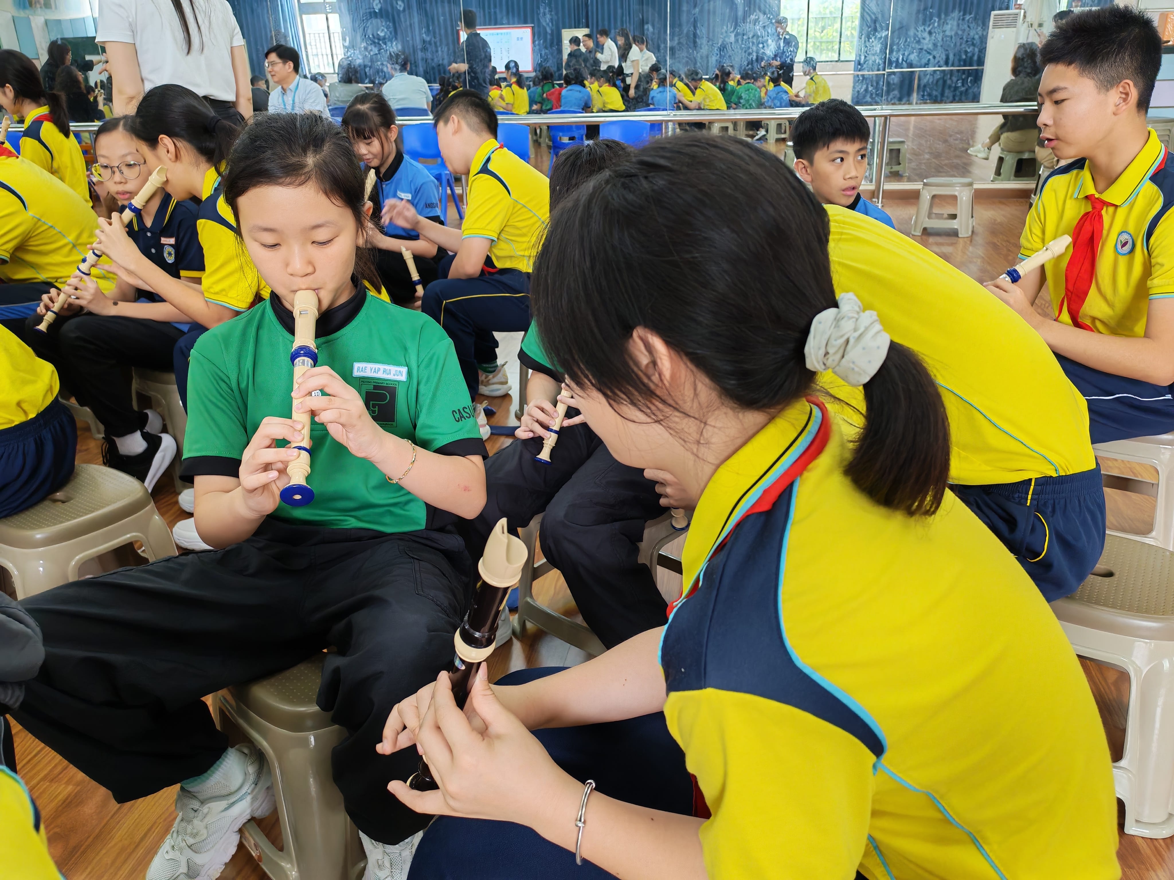 Students learning a traditional skill together.