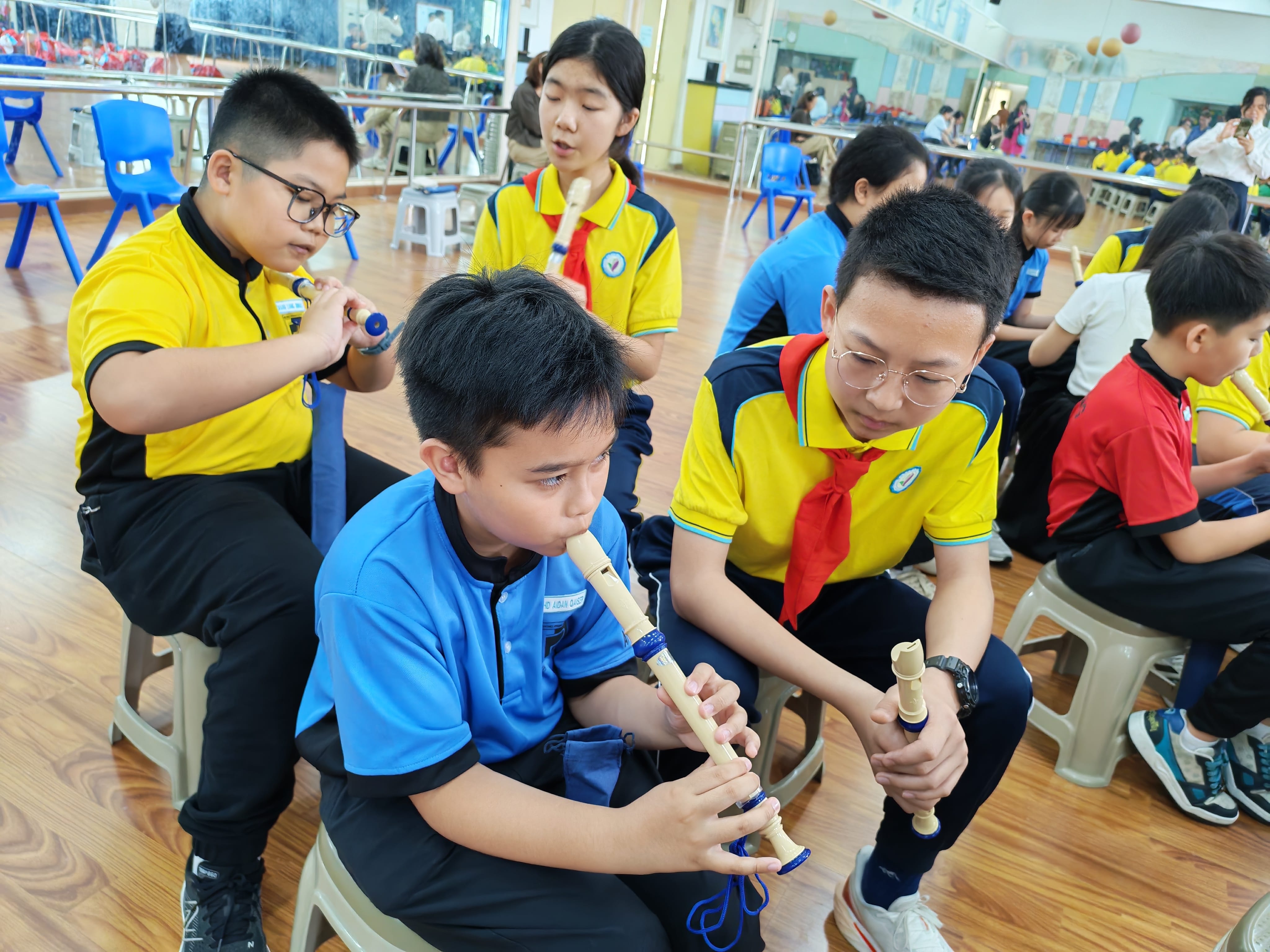 Students learning a traditional skill together.