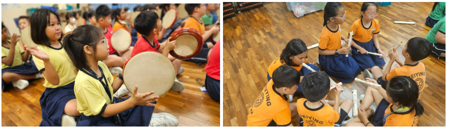 Children in uniforms sit on a floor playing hand drums on the left and recorders on the right during a music class.