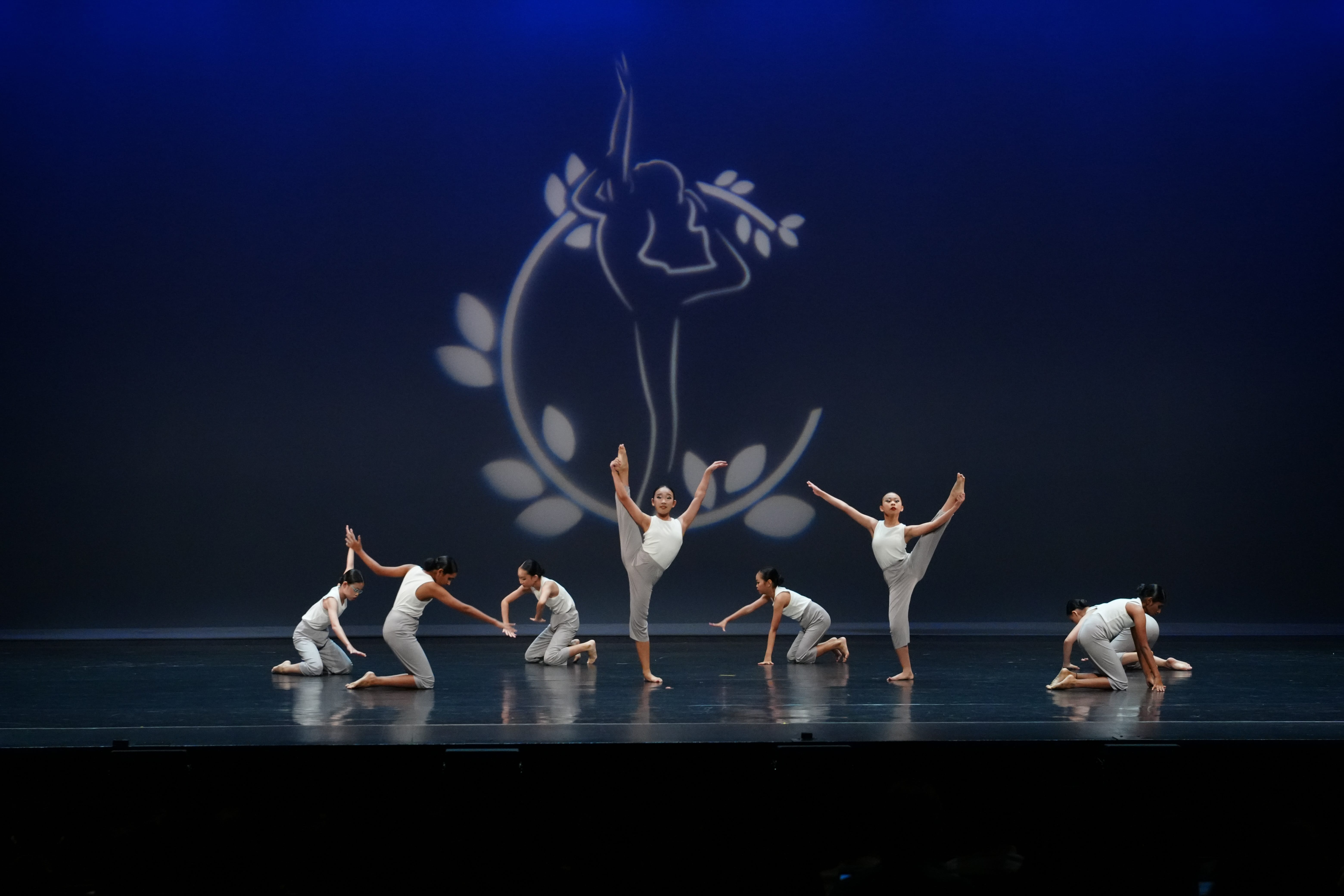 Dancers in their choreographed positions on stage