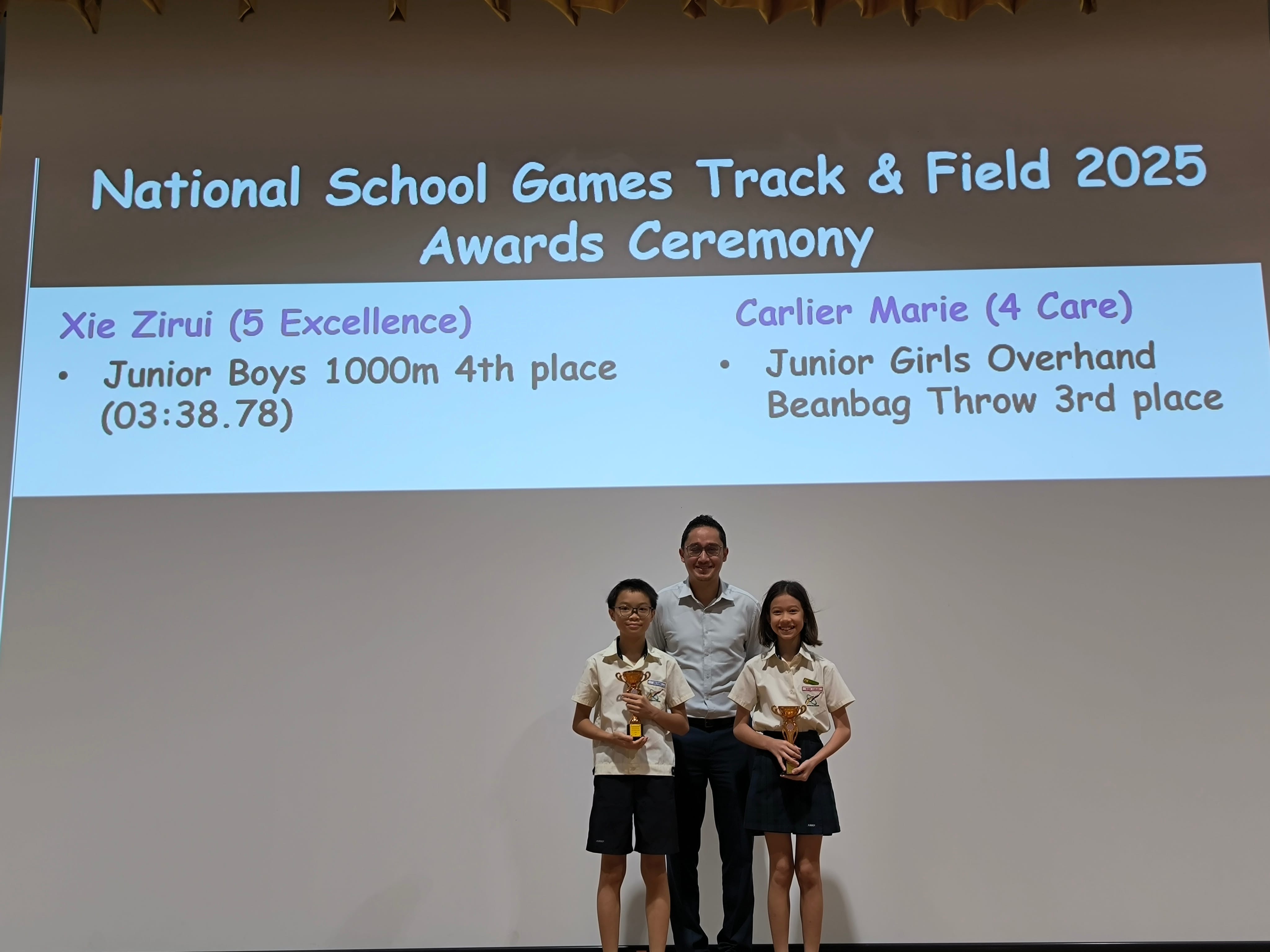 Photo of Xie Zirui (left) and Carlier Marie (right) with school principal