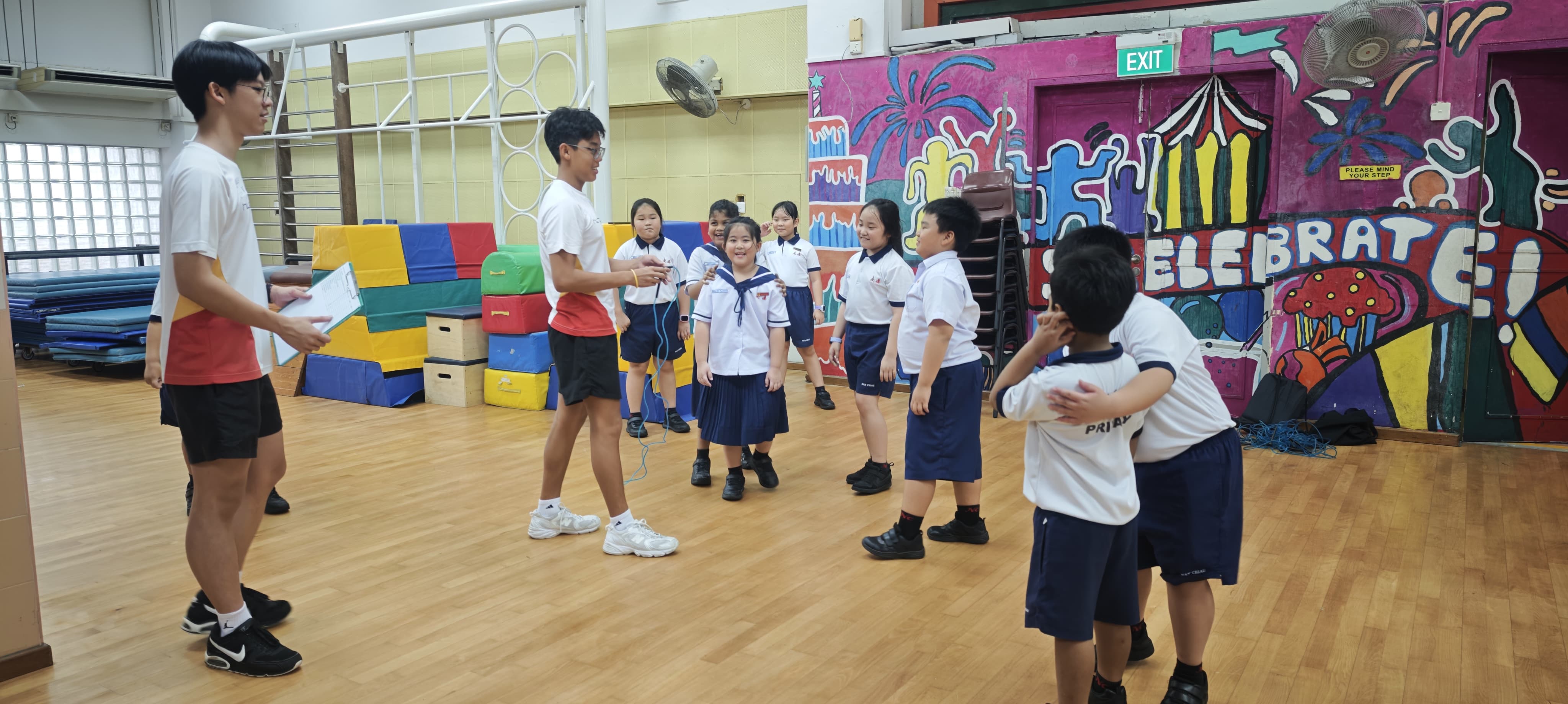 Hwa Chong students conducting activity at the school hall.