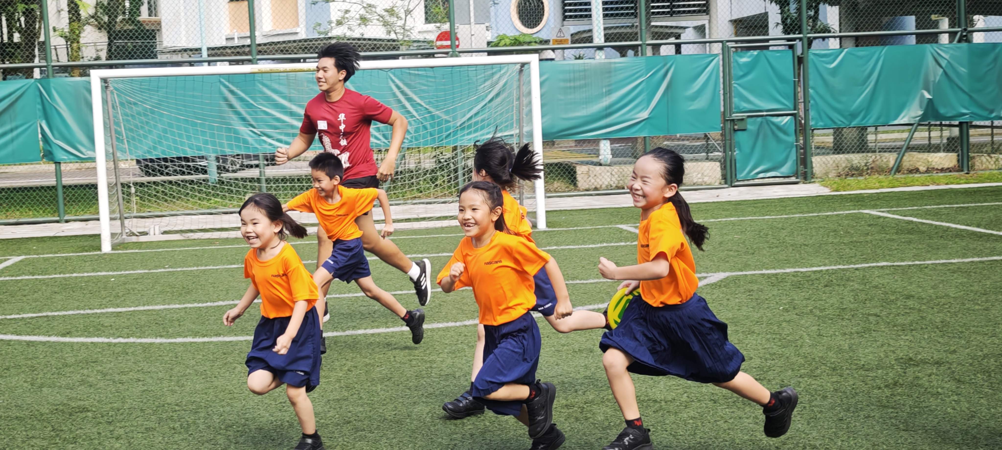 Hwa Chong students conducting activity at the school field.