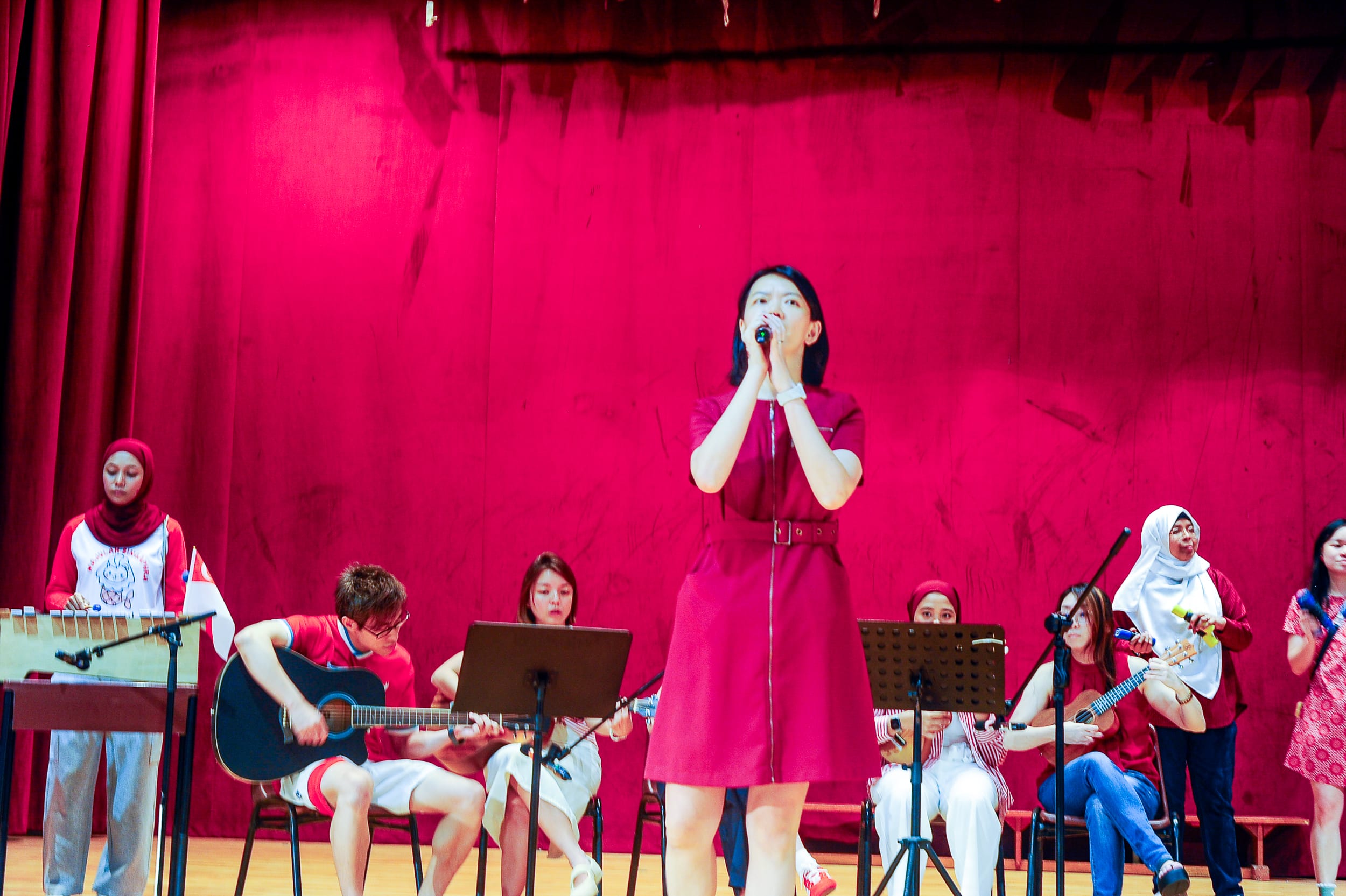 Teachers performing on stage.