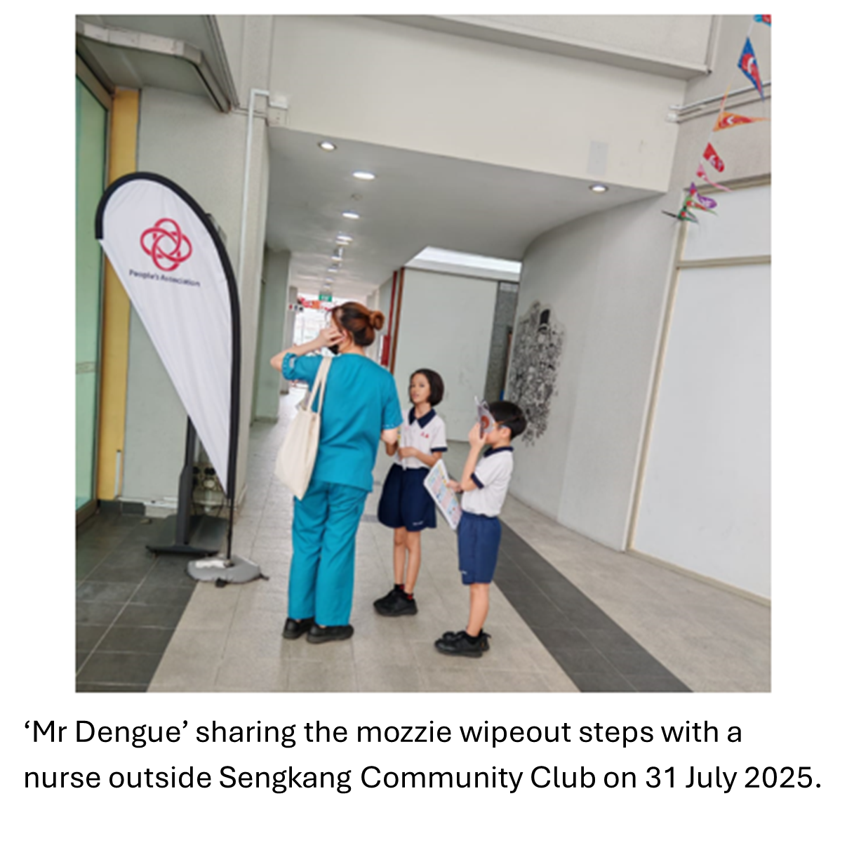 Two students sharing with a nurse the mozzie wipeout steps.