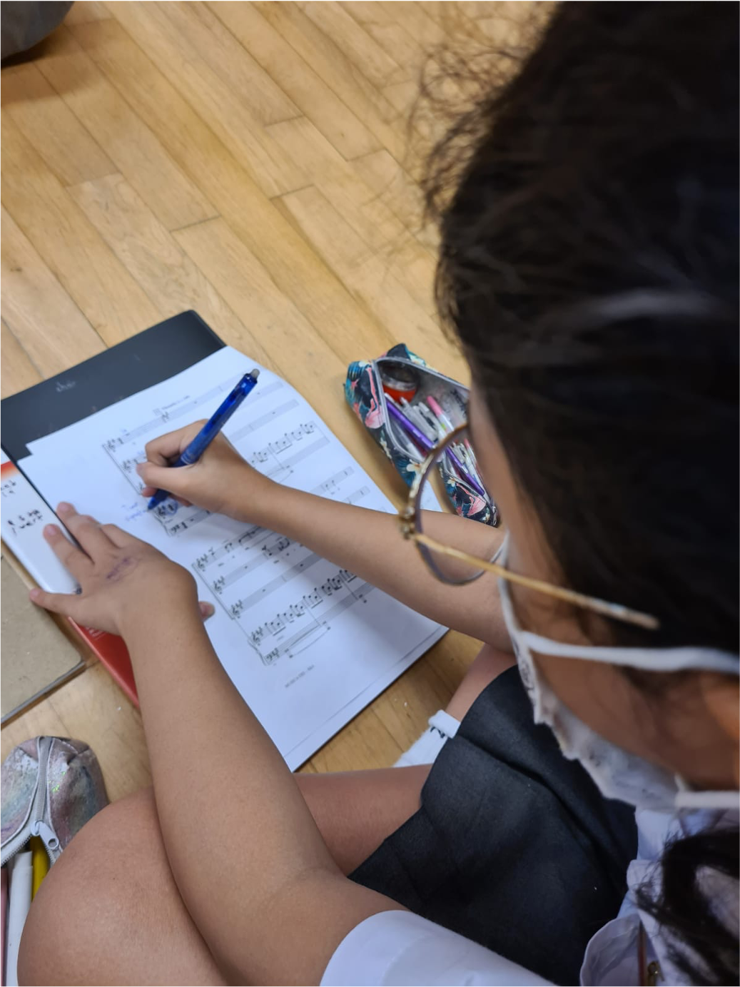 a student studying the scores