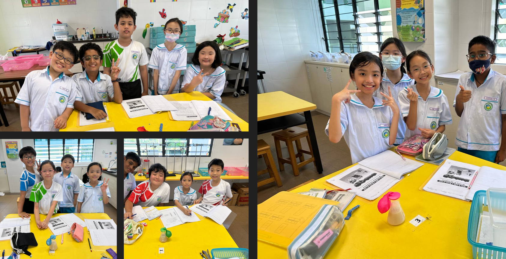 Groups of school children in white uniforms pose smiling at yellow tables with worksheets in a classroom.