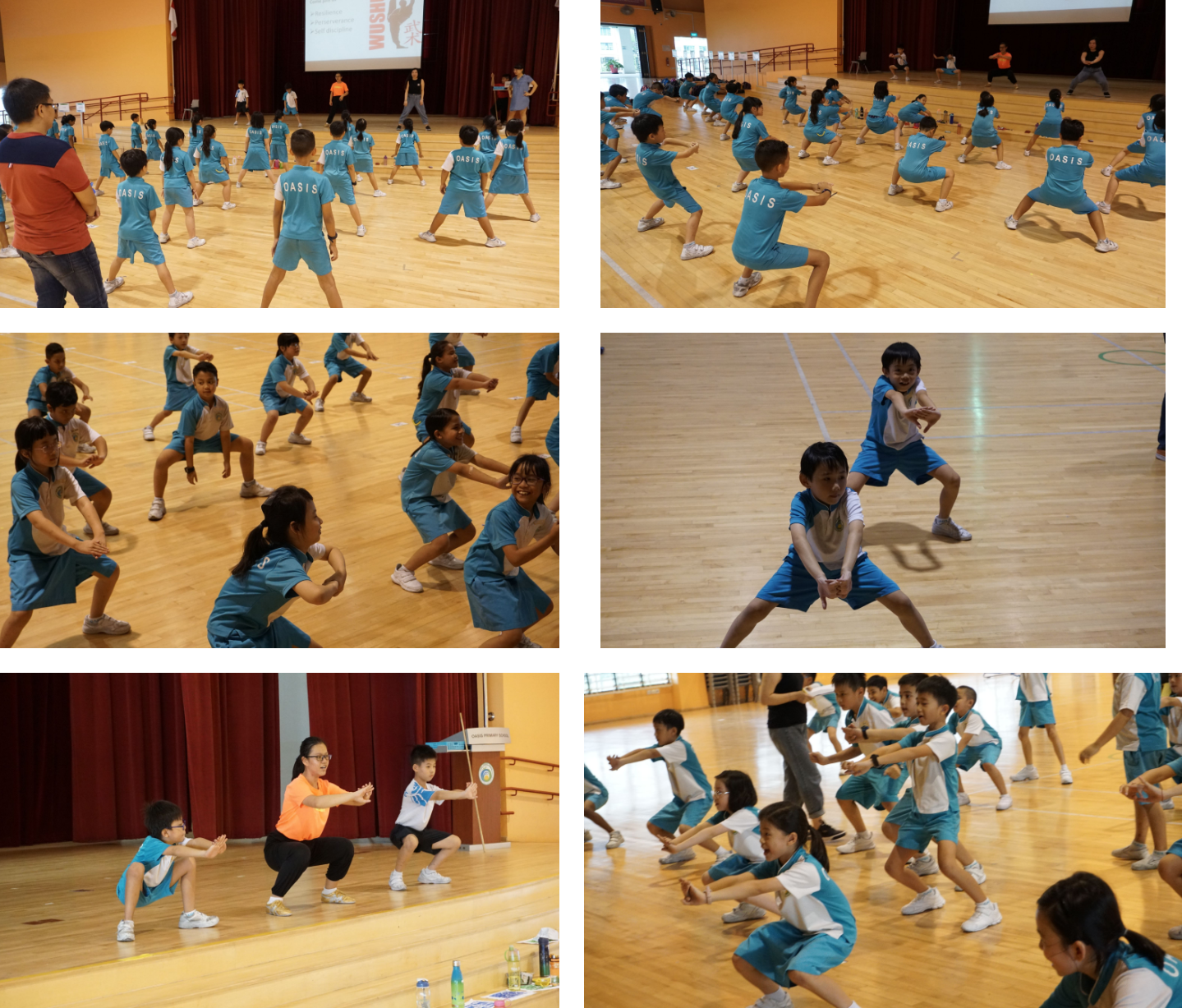 Children in blue uniforms practice martial arts movements in a school gymnasium, guided by instructors.