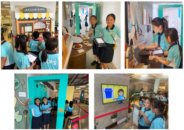 Students in blue uniforms explore a school exhibition called Bazaar Raya, using tablets and worksheets at various display stations.