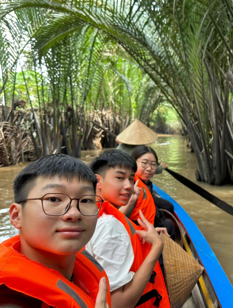 Students on a boat exploring My Tho Village.