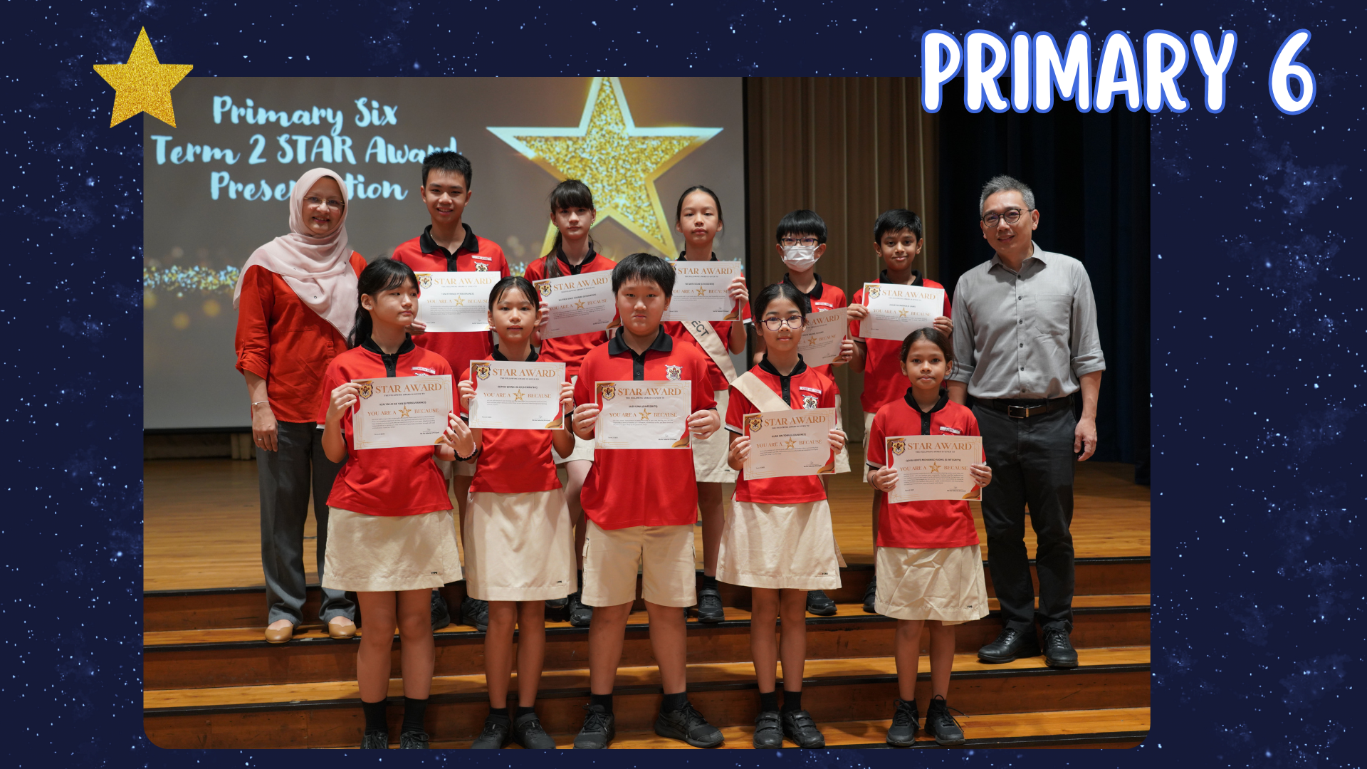 Primary 6 students in red uniforms hold Star Award certificates on stage with two adults at a school ceremony.
