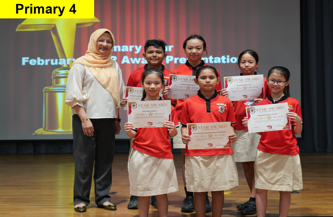 A teacher stands with six Primary 4 students holding Star Award certificates on a stage.