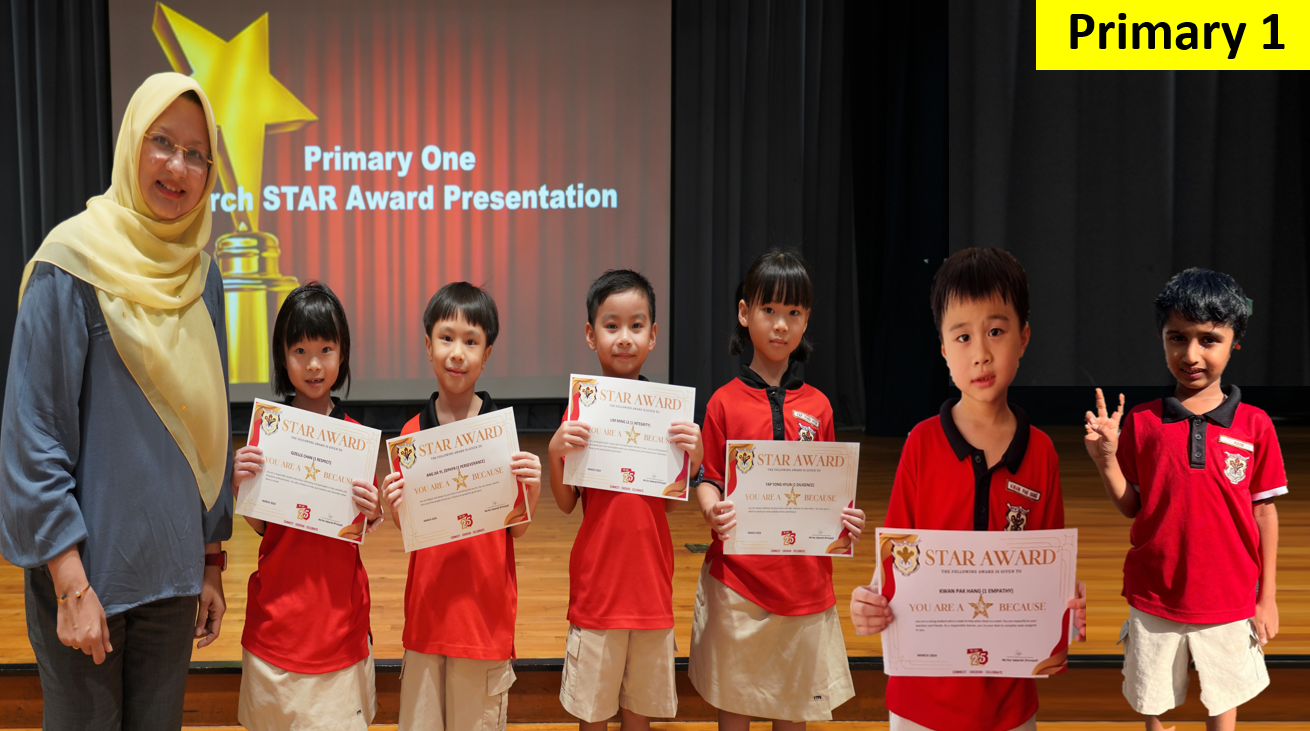 Six young students in red uniforms hold Star Award certificates on stage with a teacher at a Primary One award presentation.