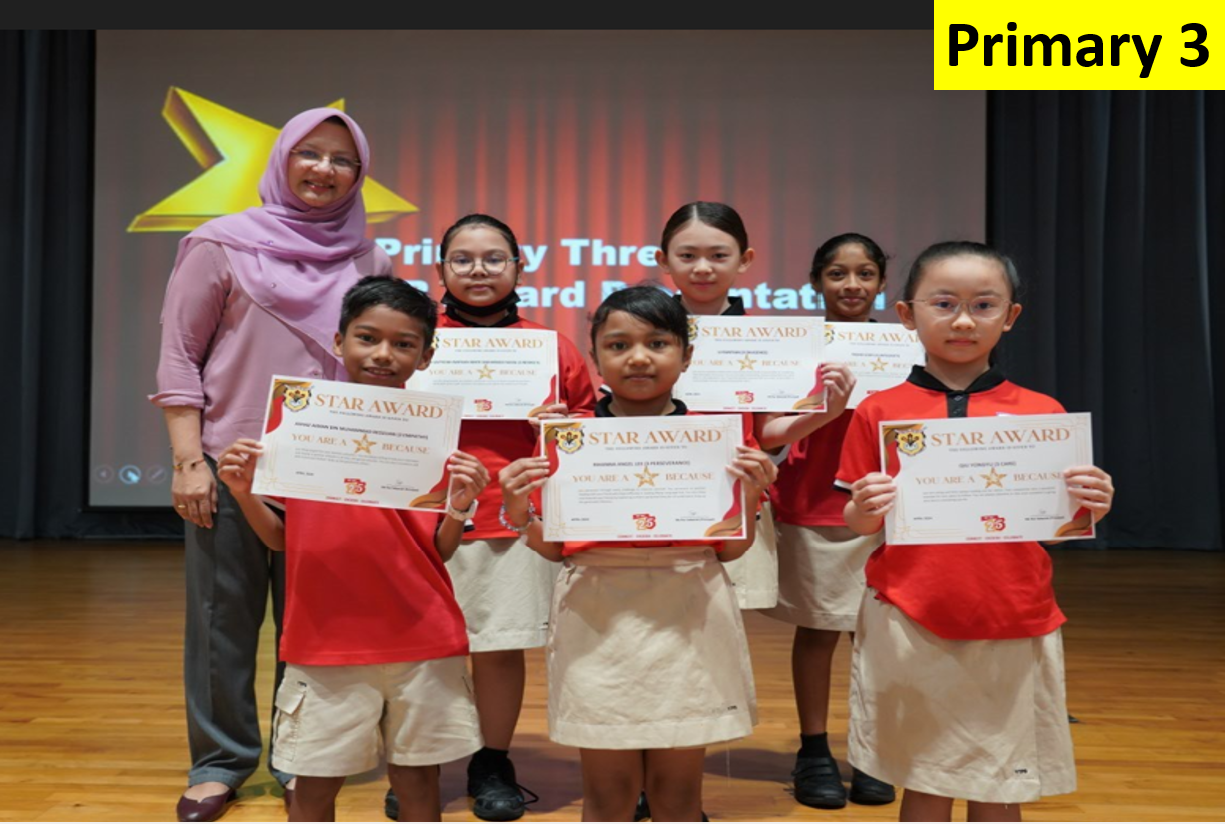 Six Primary 3 students in red uniforms hold Star Award certificates, standing with a teacher on a stage.