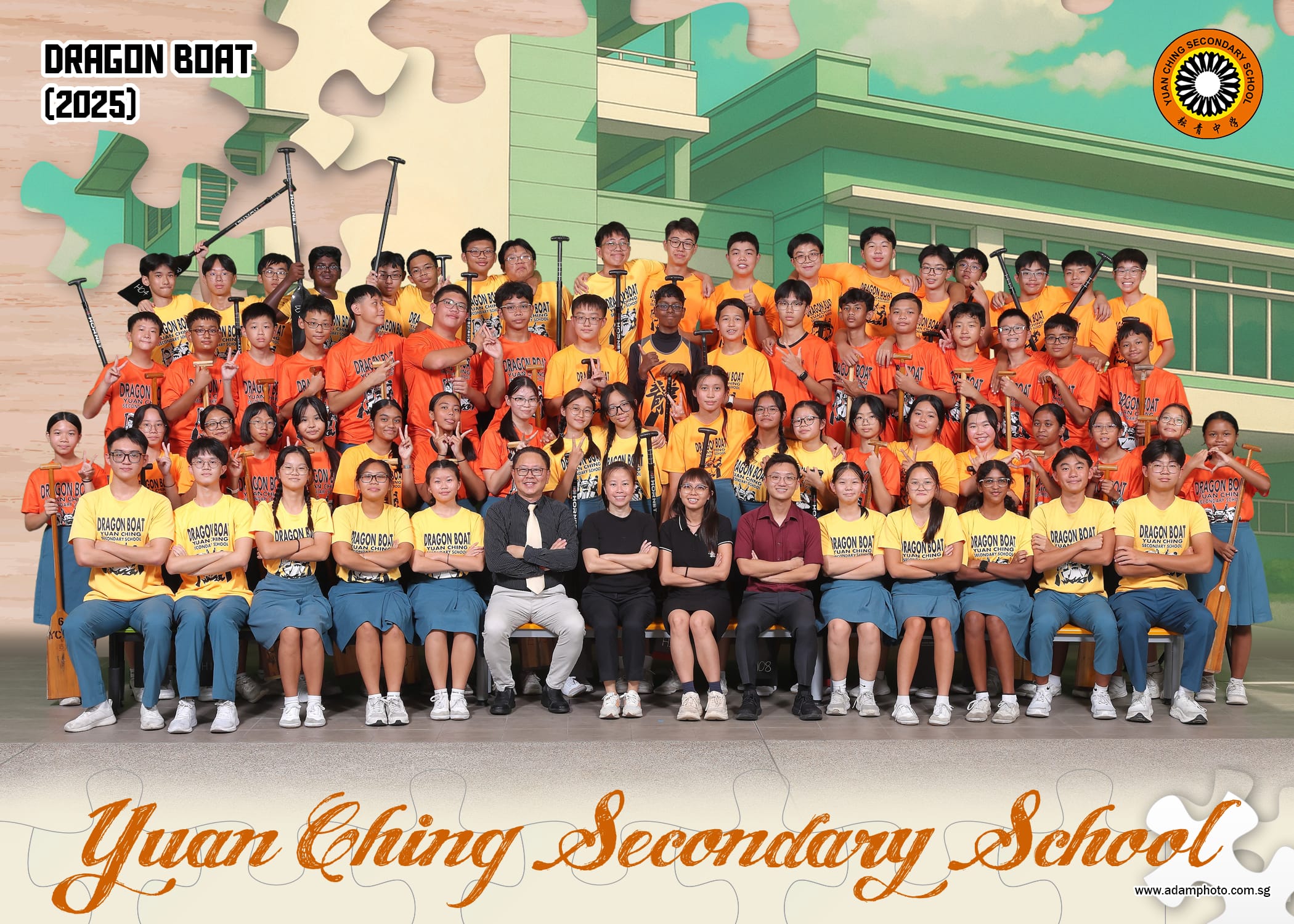 Group photo of students in orange and yellow Dragon Boat shirts holding paddles, 2025, in front of school.