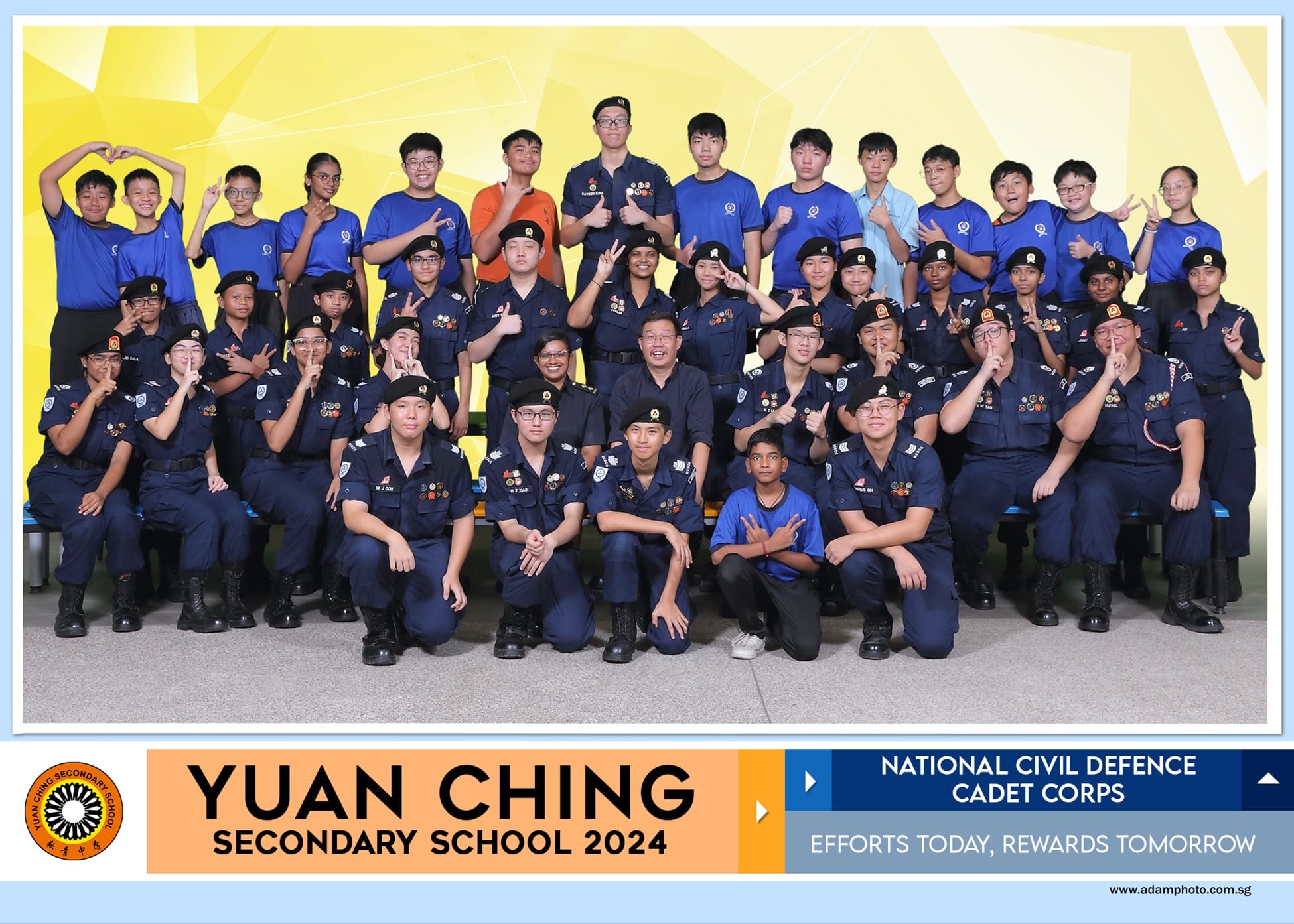 Group photo of Yuan Ching Secondary School 2024 National Civil Defence Cadet Corps students in uniform posing together.