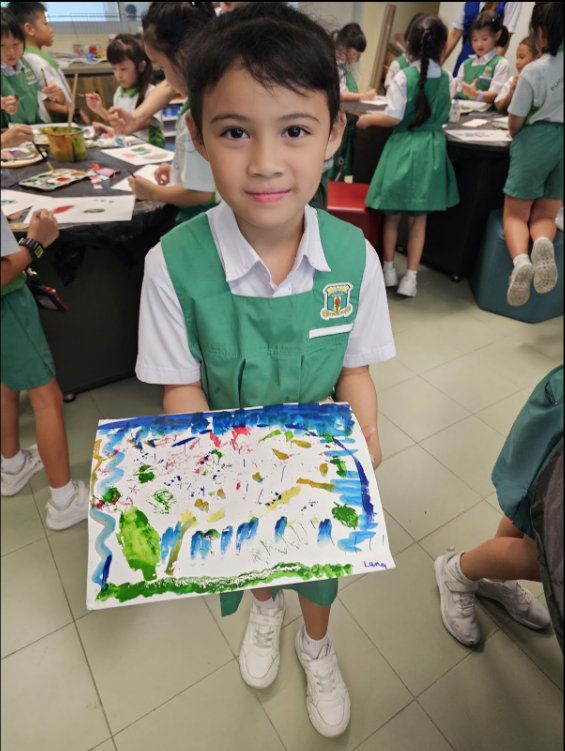 student showing off completed art work