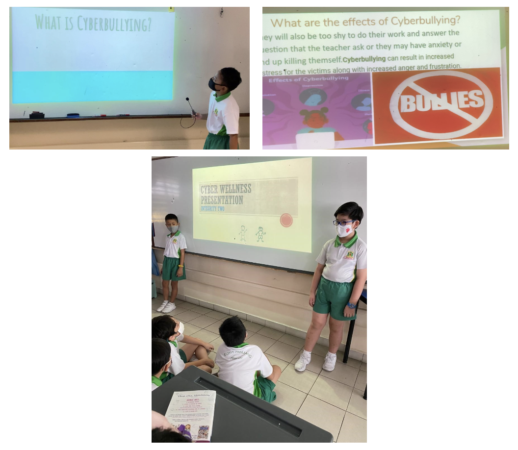 Students in uniforms present a cyberbullying and cyber wellness slideshow to classmates in a classroom.