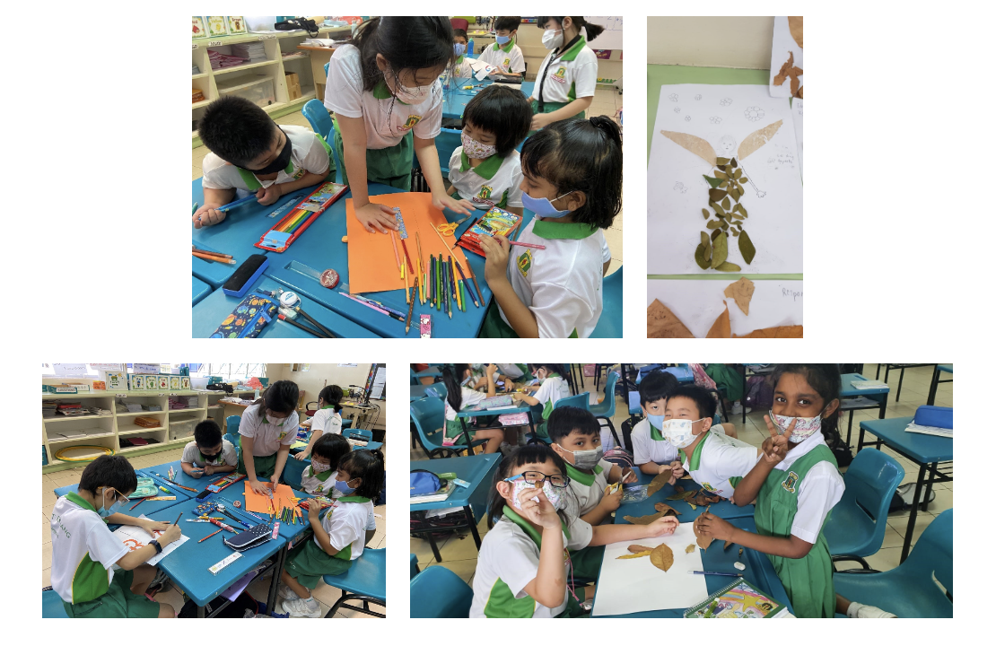 Young students in masks work on art projects using colored pencils and dried leaves at blue classroom tables.