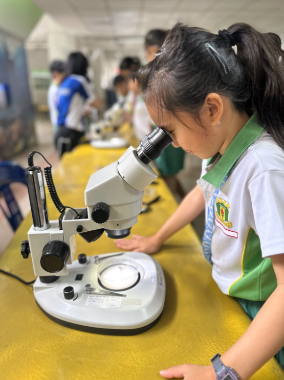 A student looking through a microscope 2