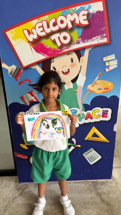 student showing off completed art work 2