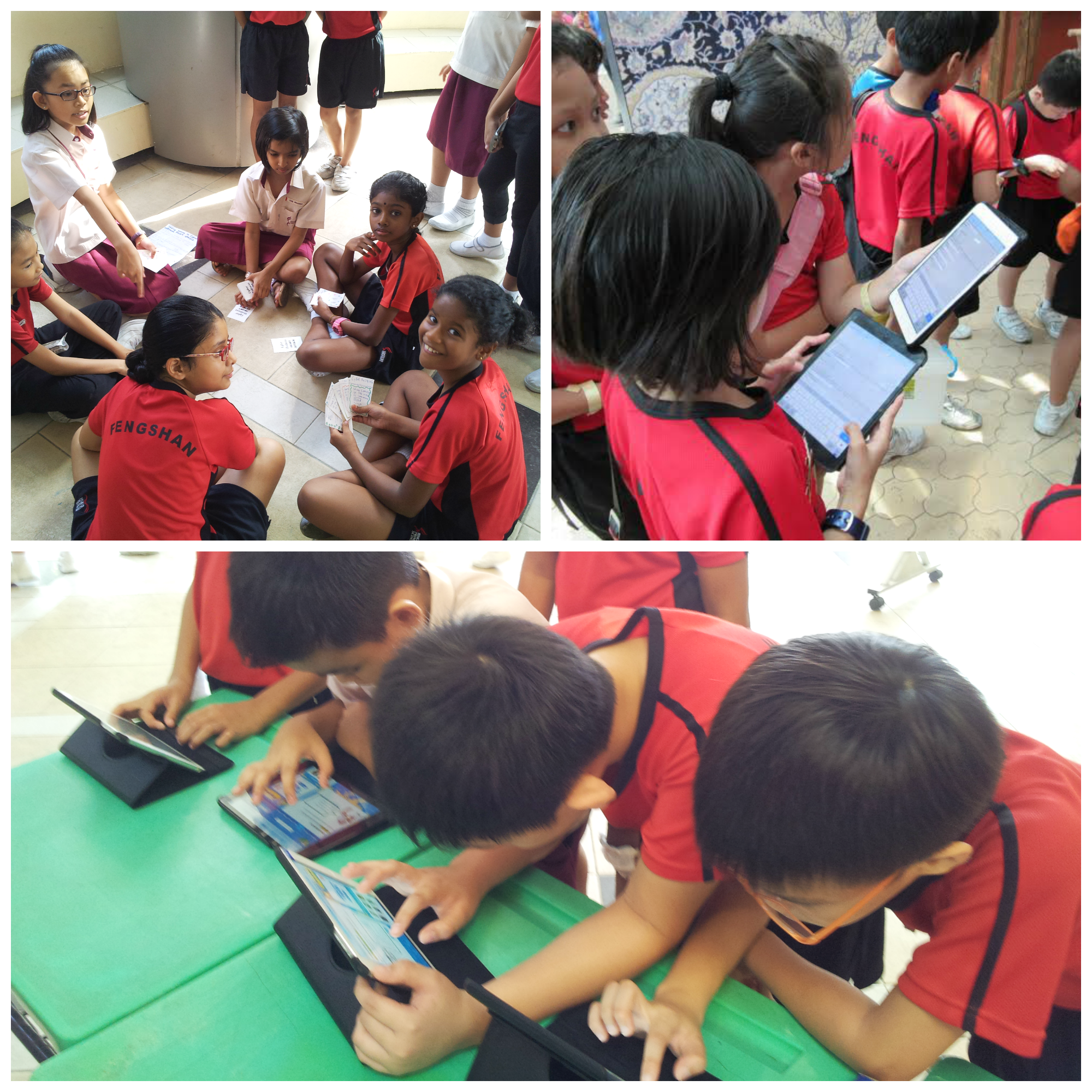 Students in red uniforms sit together and use tablets in groups on the floor and at a green table.