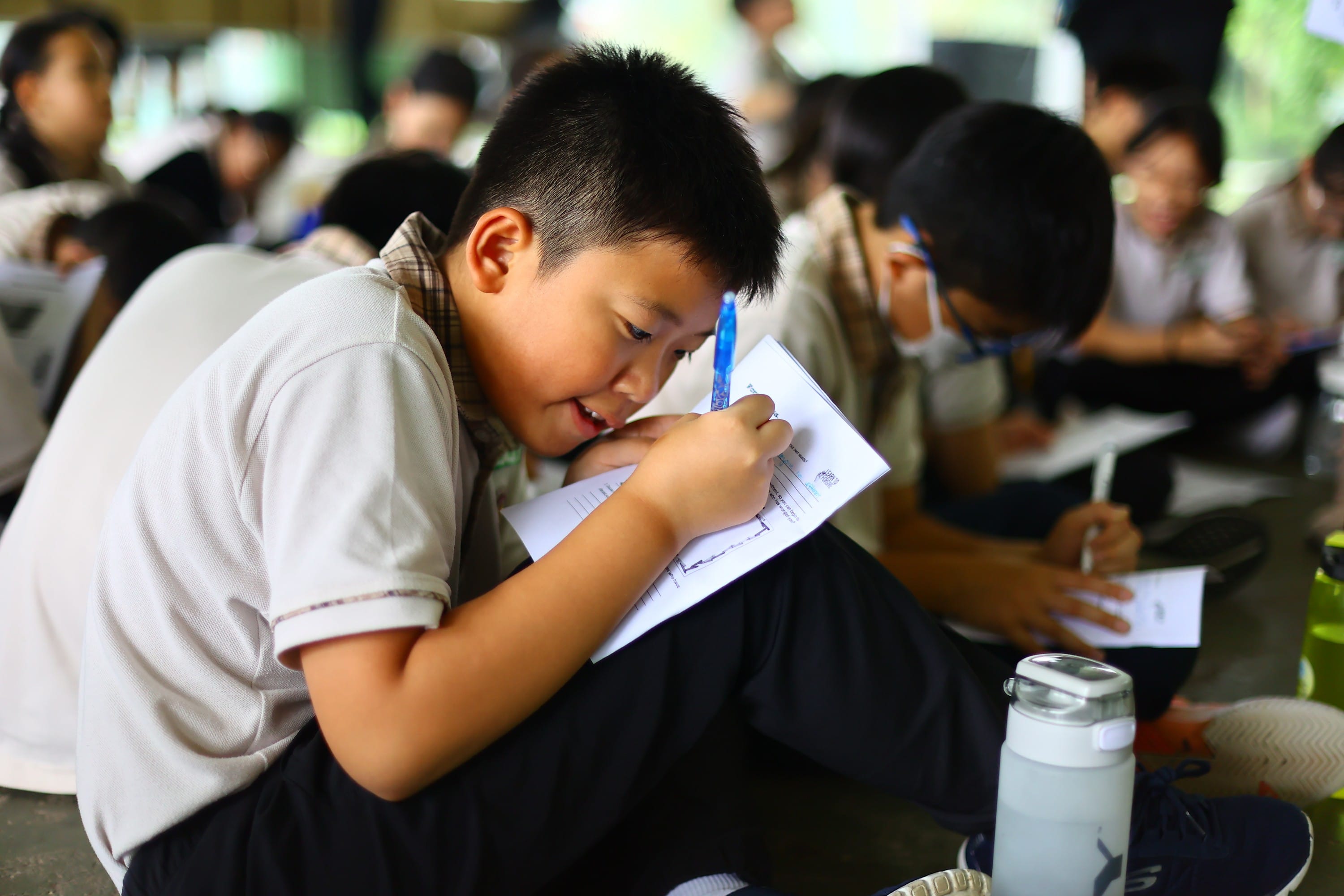 A P5 student doing reflection for the camp