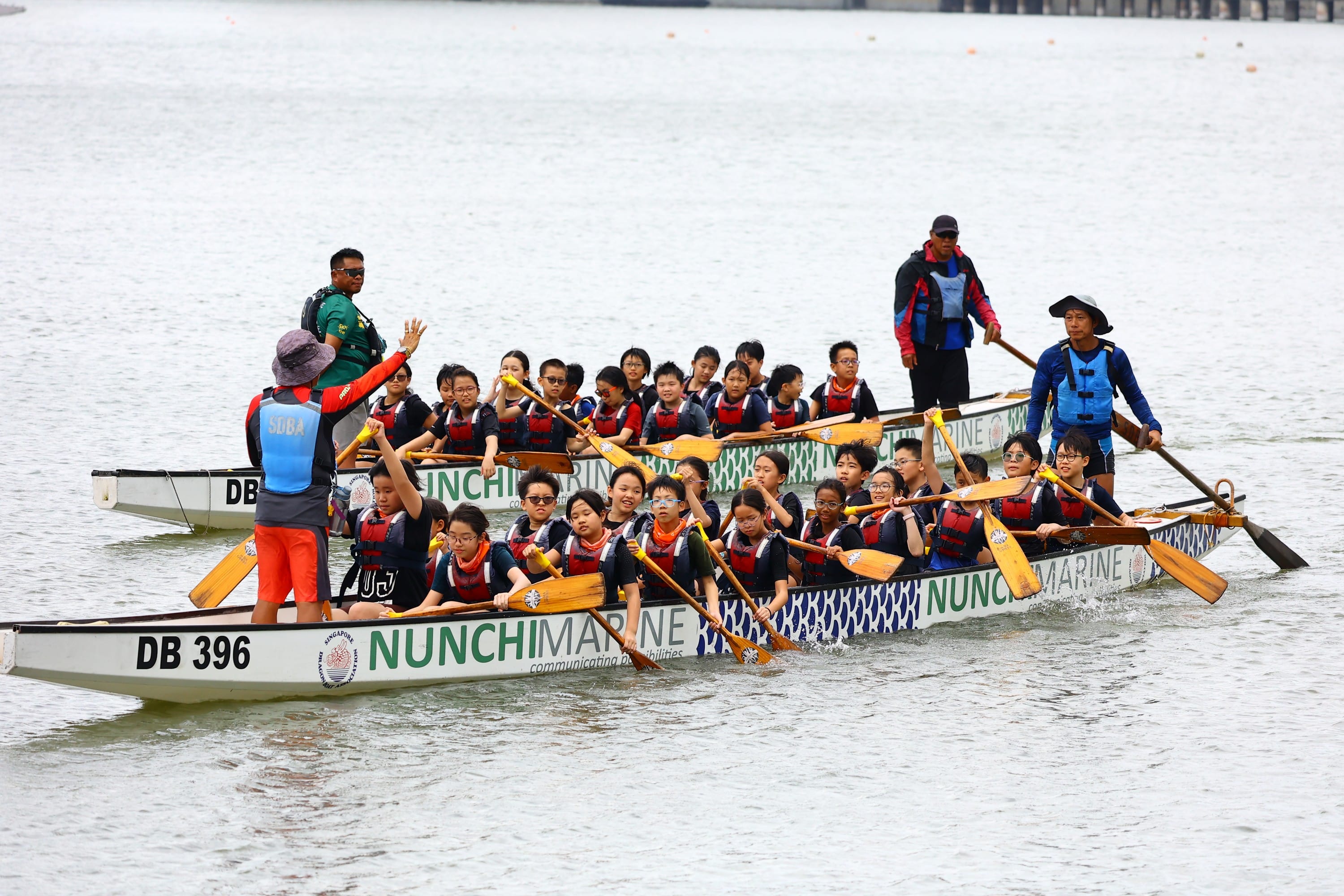 Two groups of P5 students on a dragon boating activity