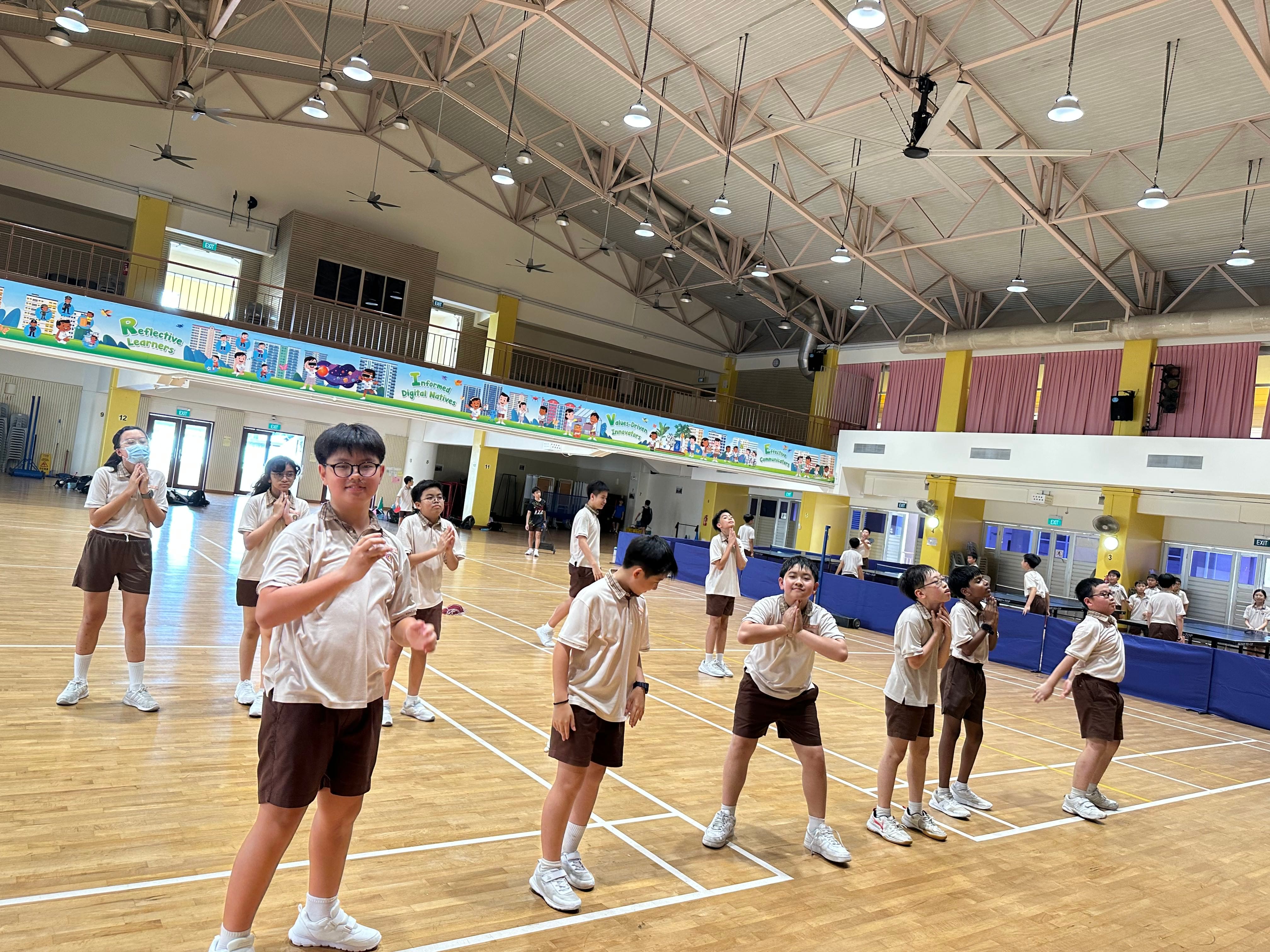 Students warming up before their badminton session