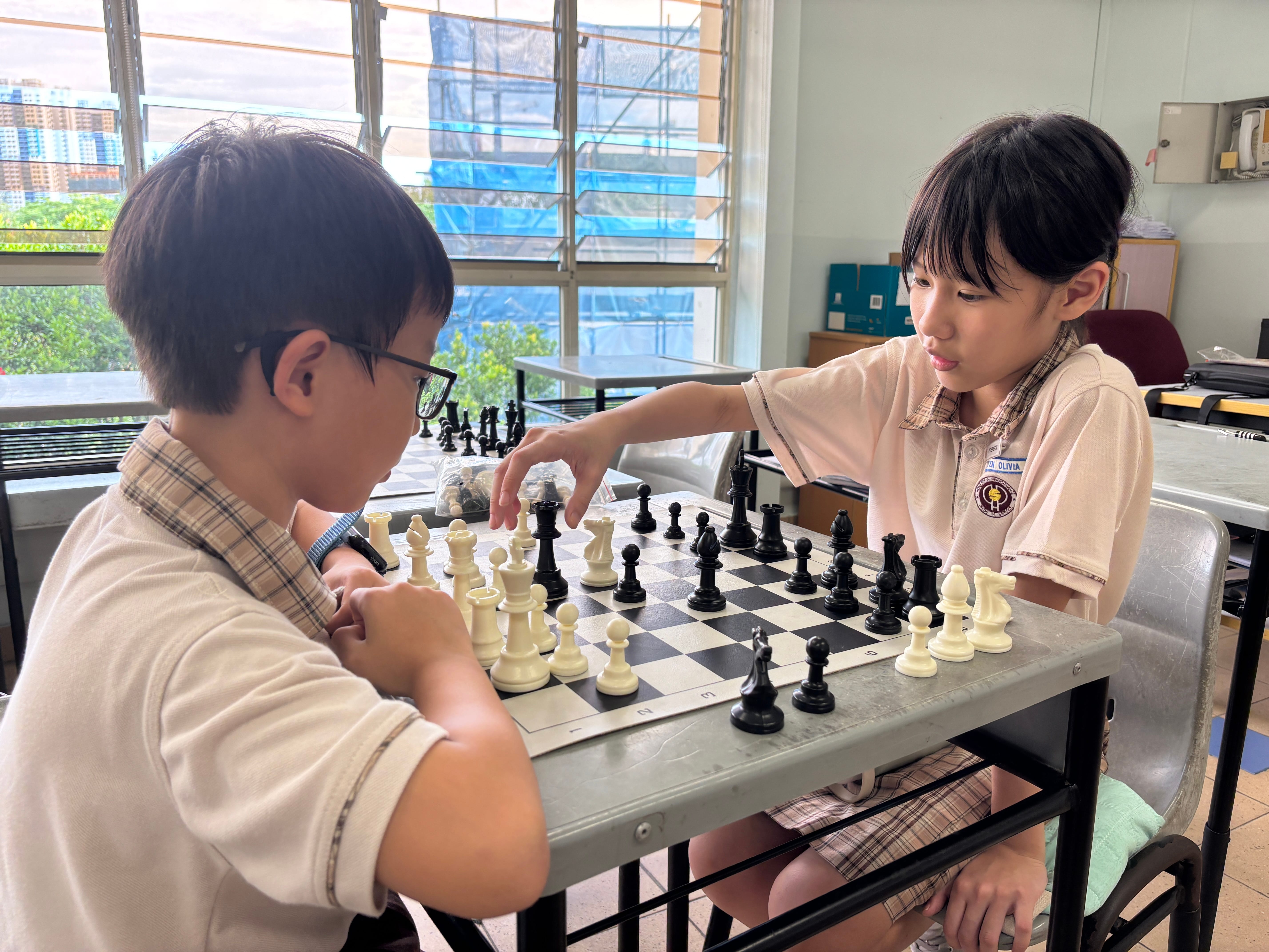 Two students playing chess