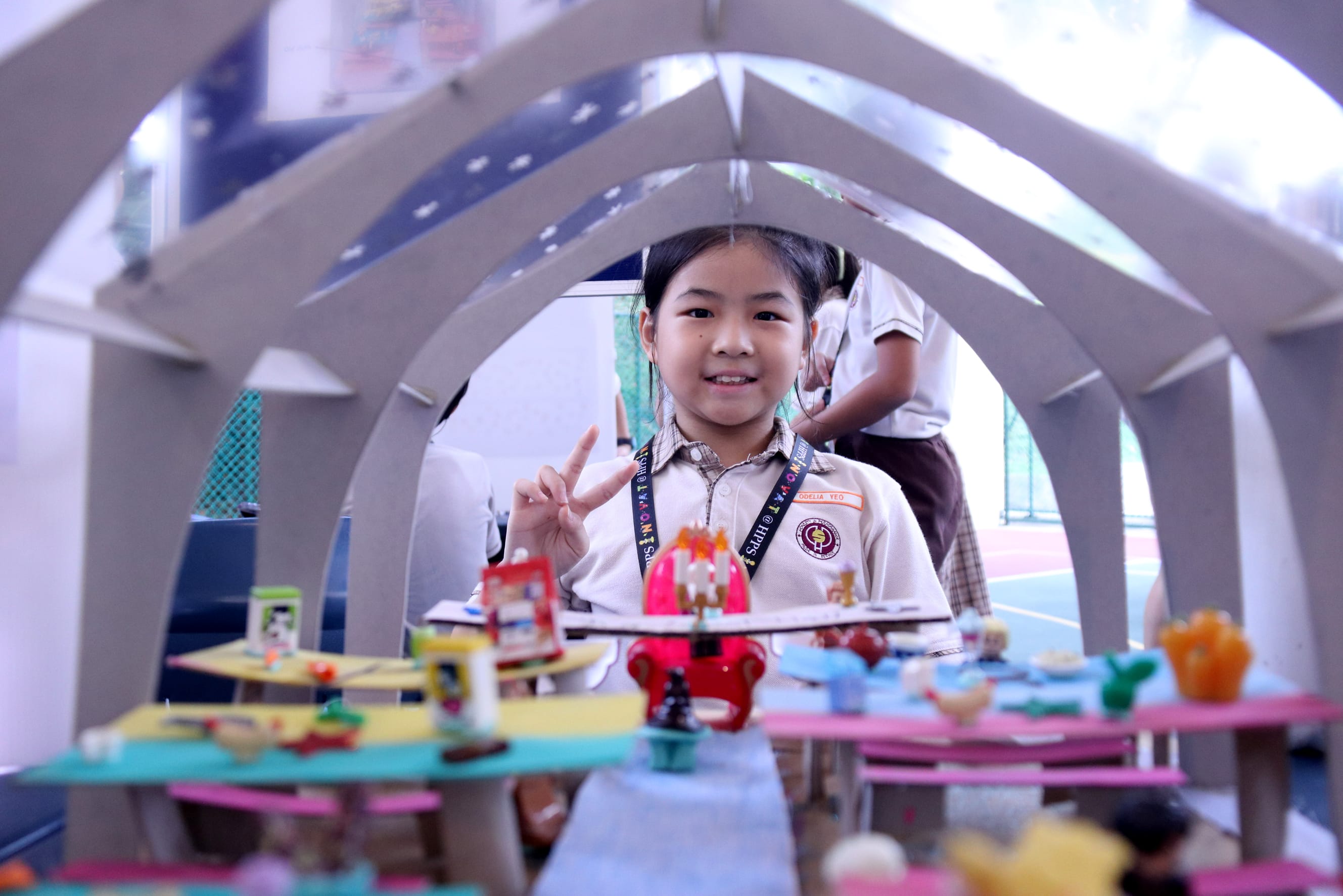 Student with the toy that she made.