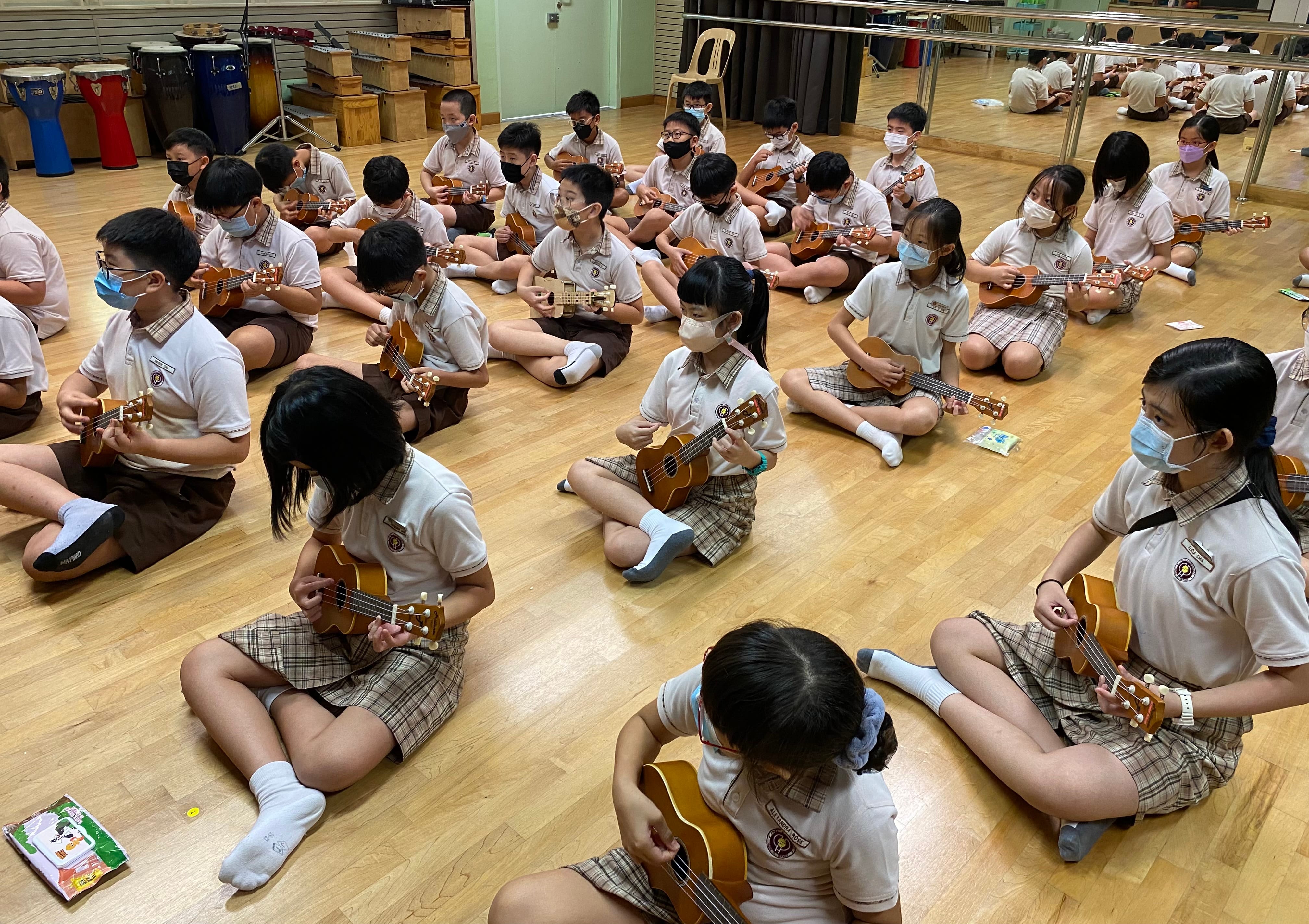 P5 students learning the Ukulele