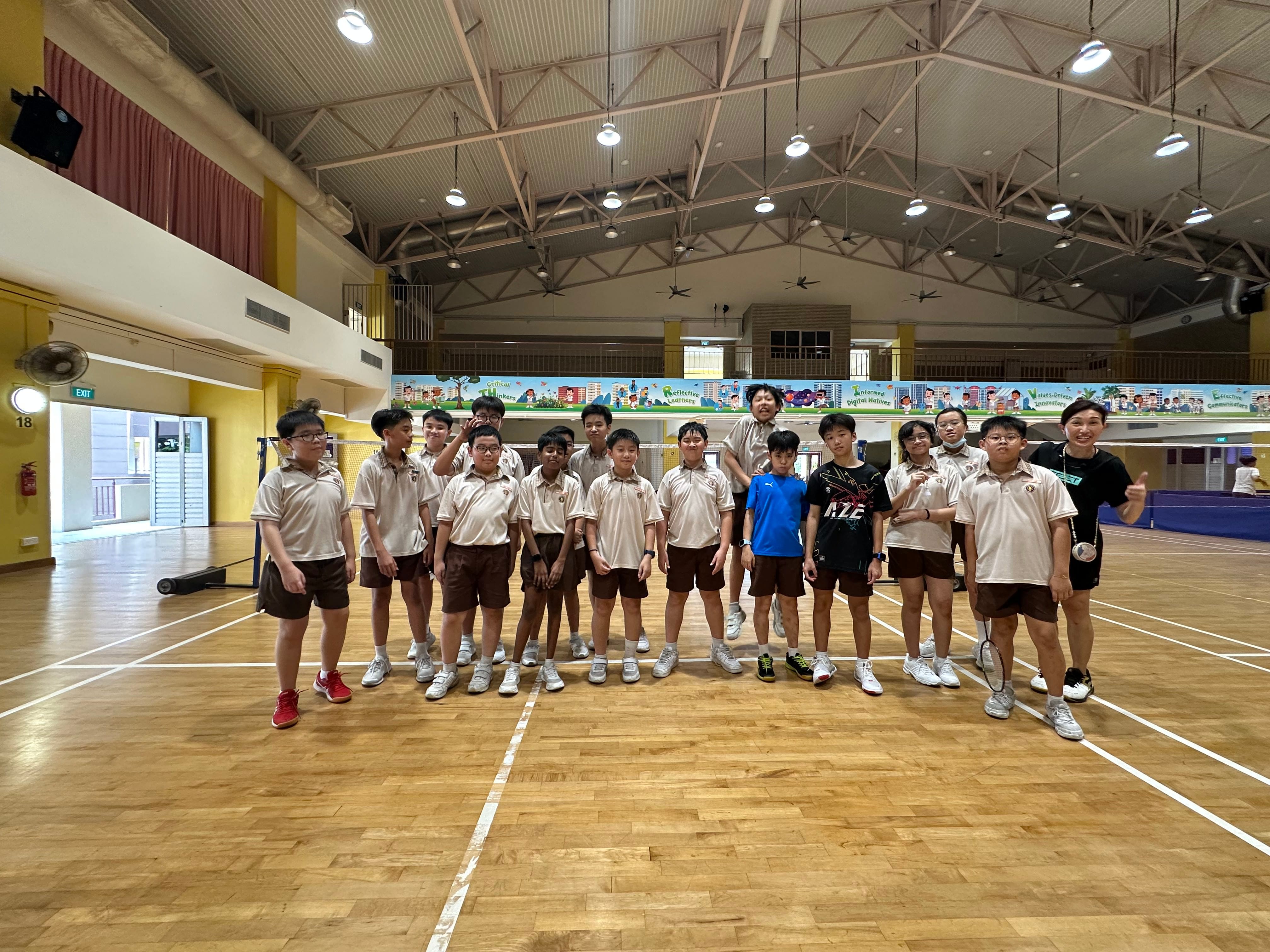 Primary 6 students taking a final group photo to commemorate their time in the CCA