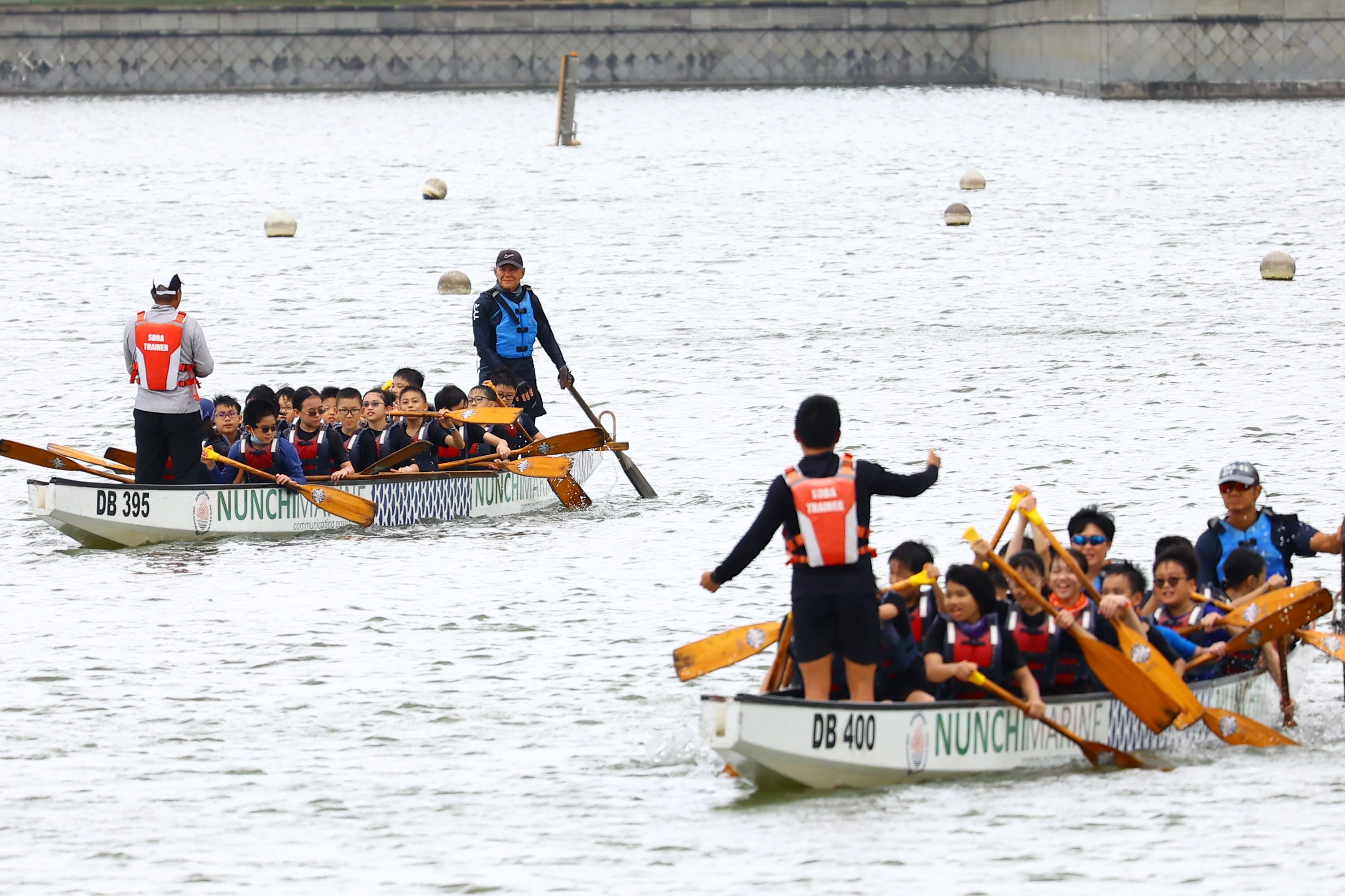 Two groups of P5 students on a dragon boating activity