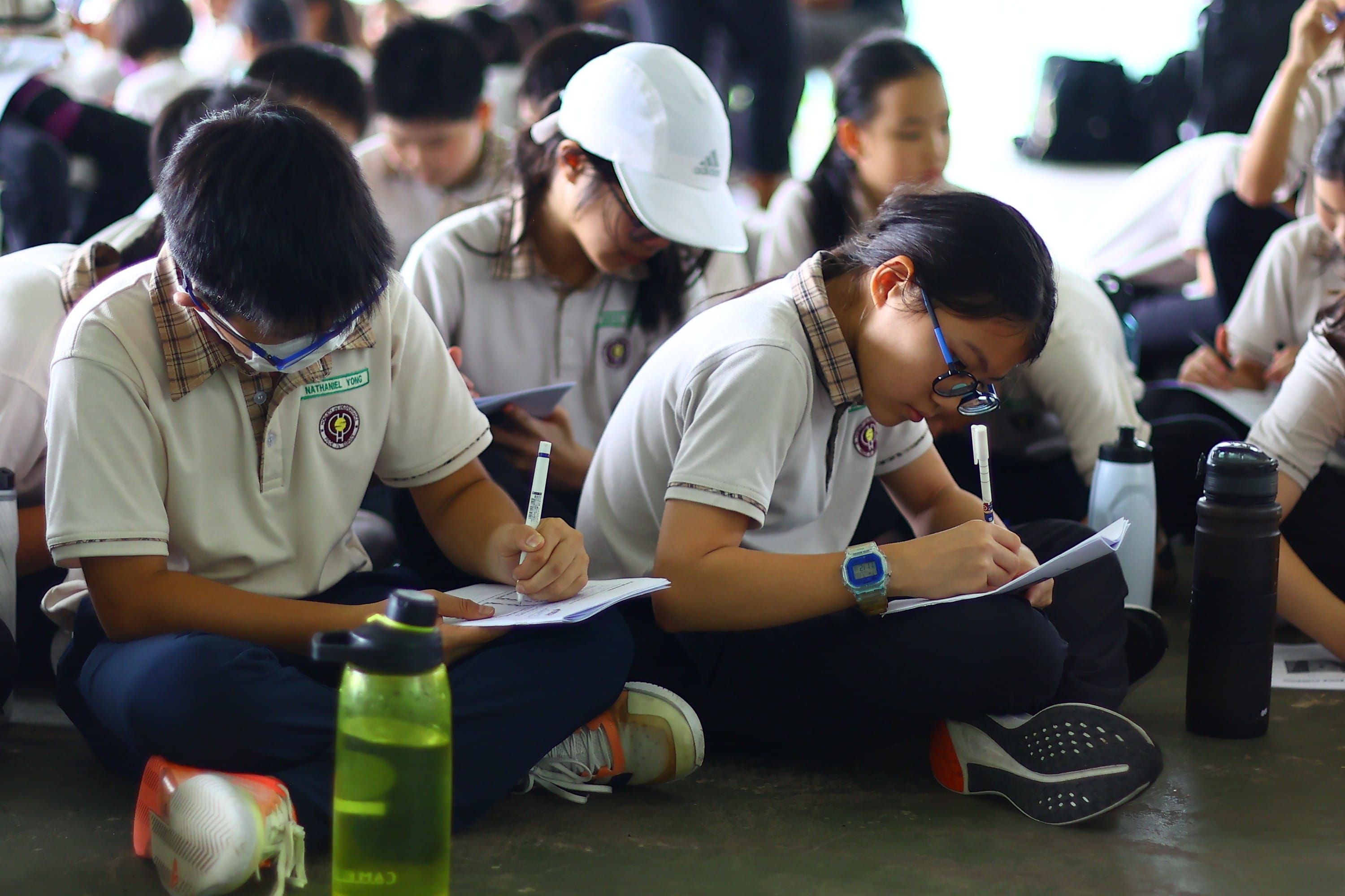 A group of P5 students doing reflection of the camp