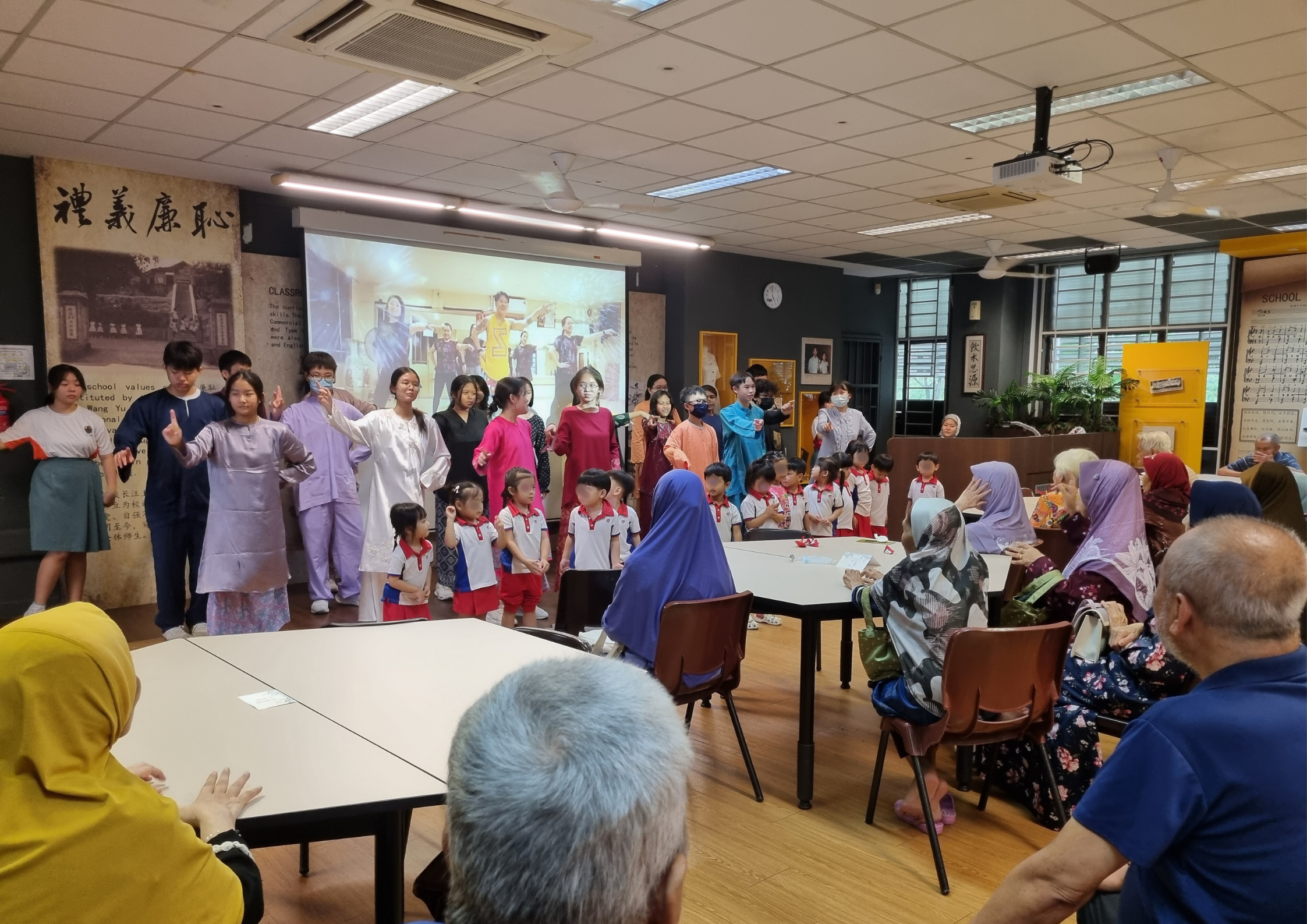 Interact Club members engaging with senior citizens in an intergenerational harmony activity