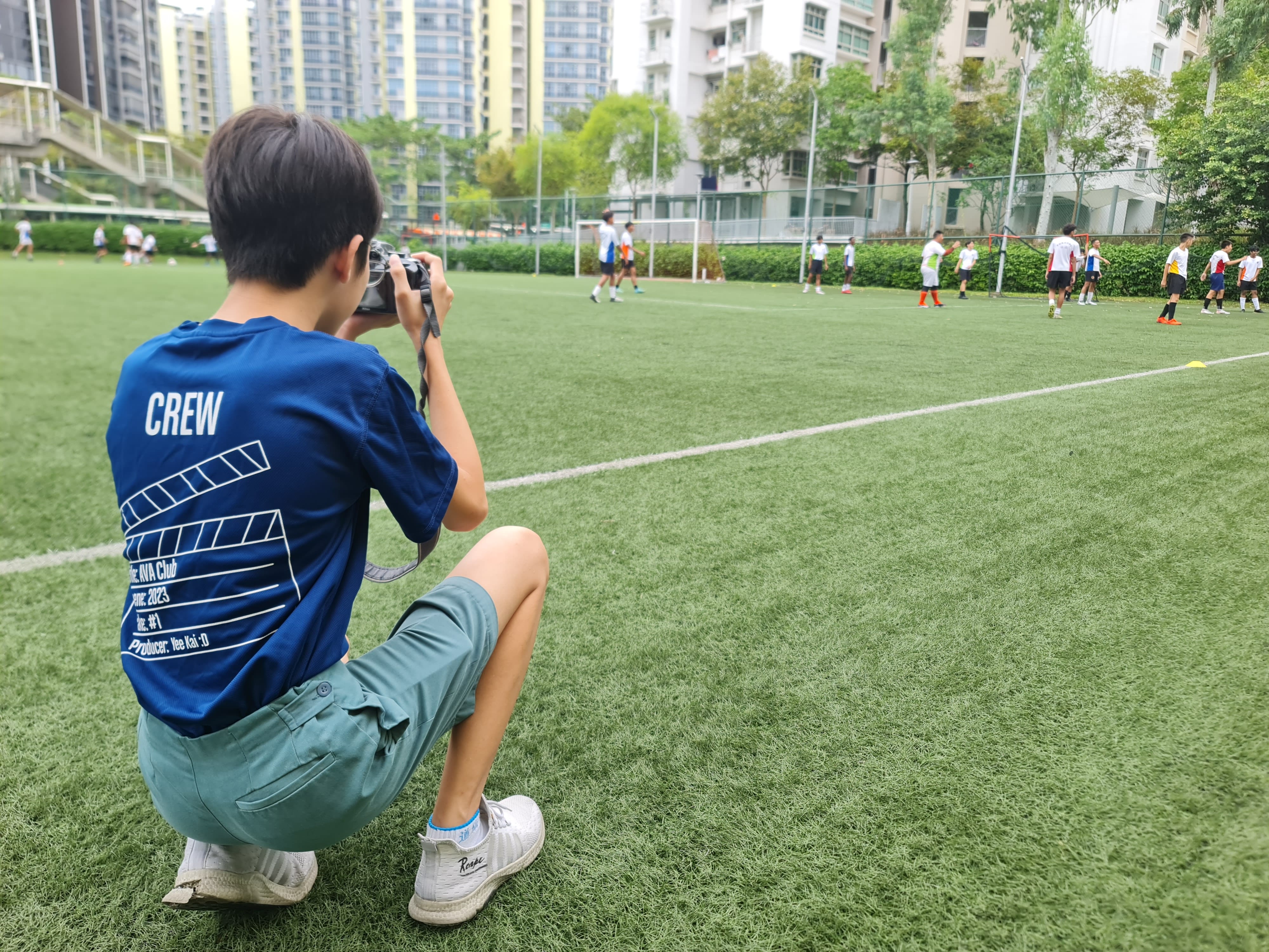 AVA Club members capturing footage or photos at a school event