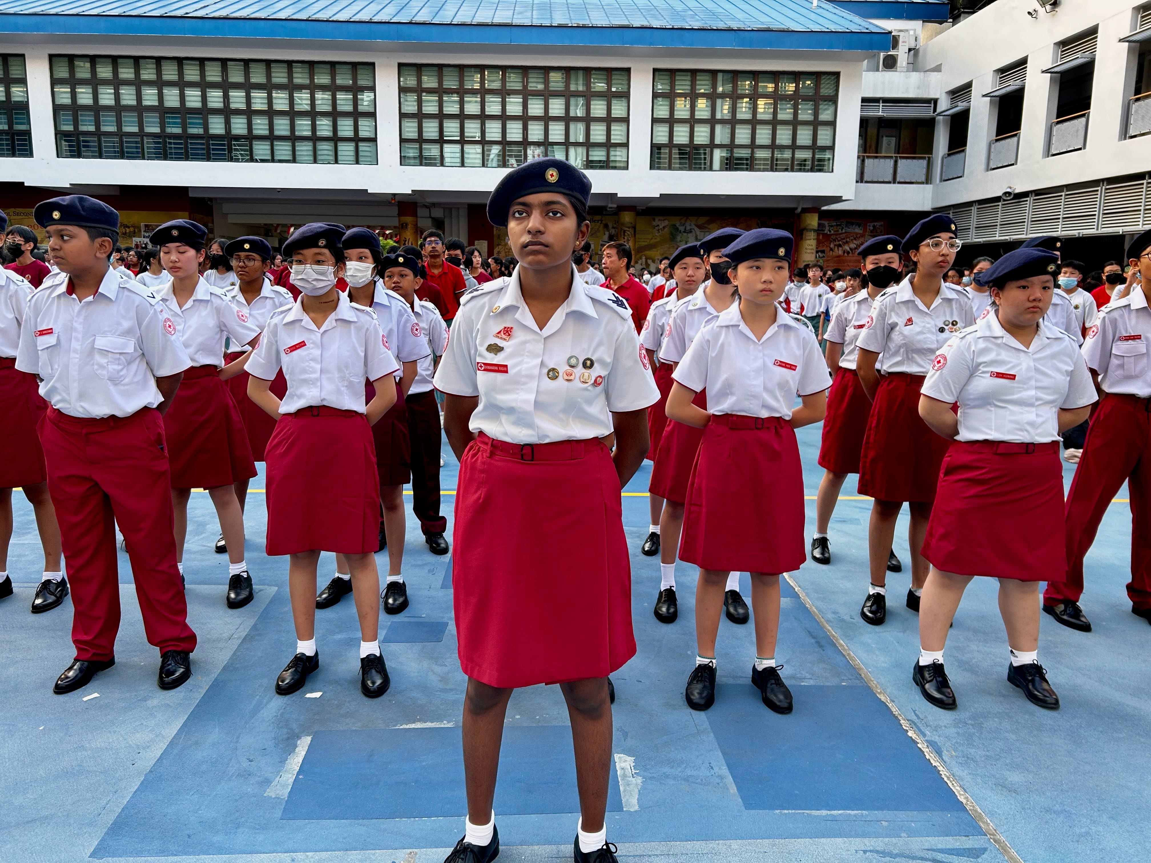 Red Cross cadets standing in formation at a parade or inspection