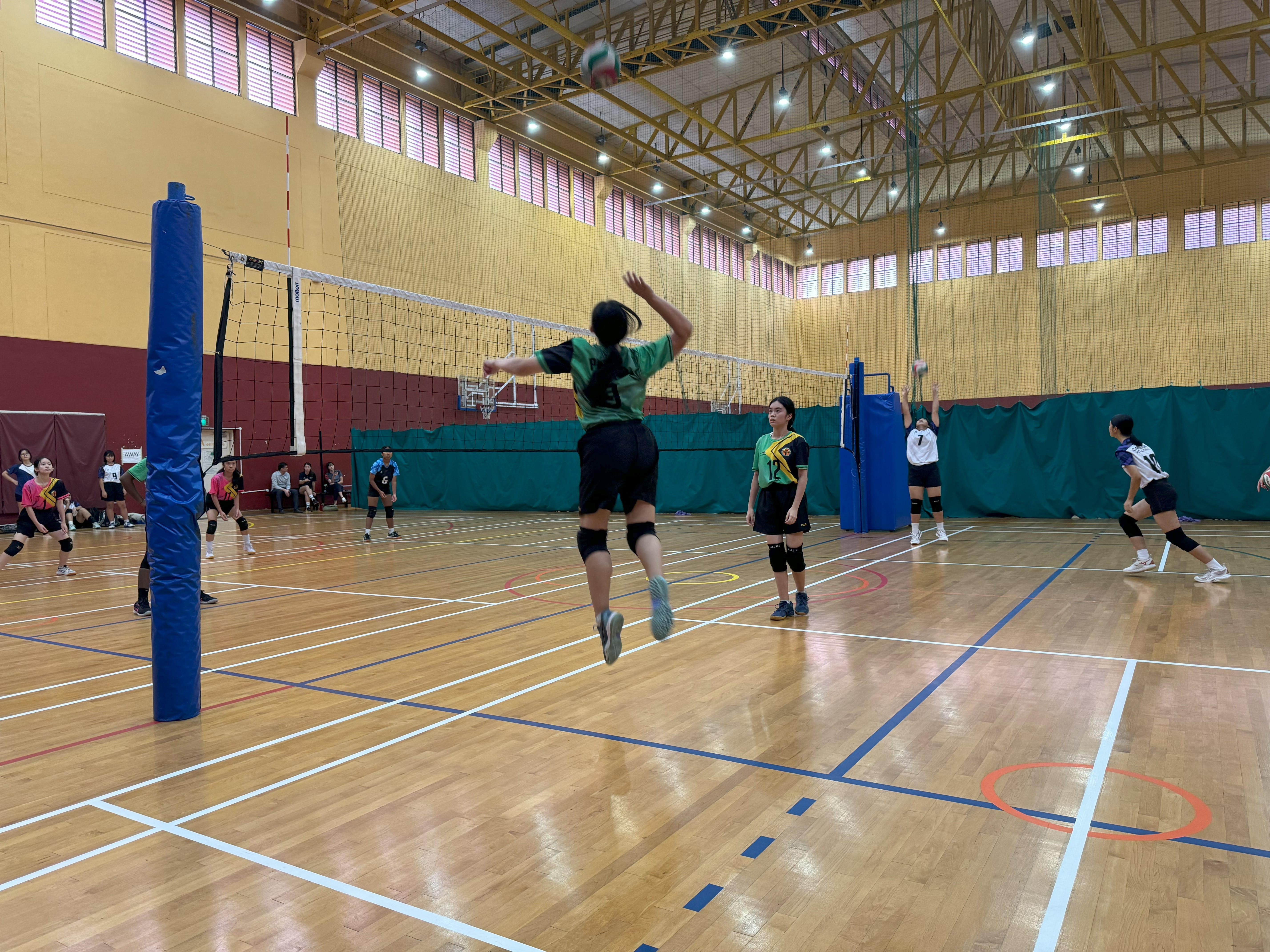 Deborah Goh from 3A serving or spiking during a volleyball match