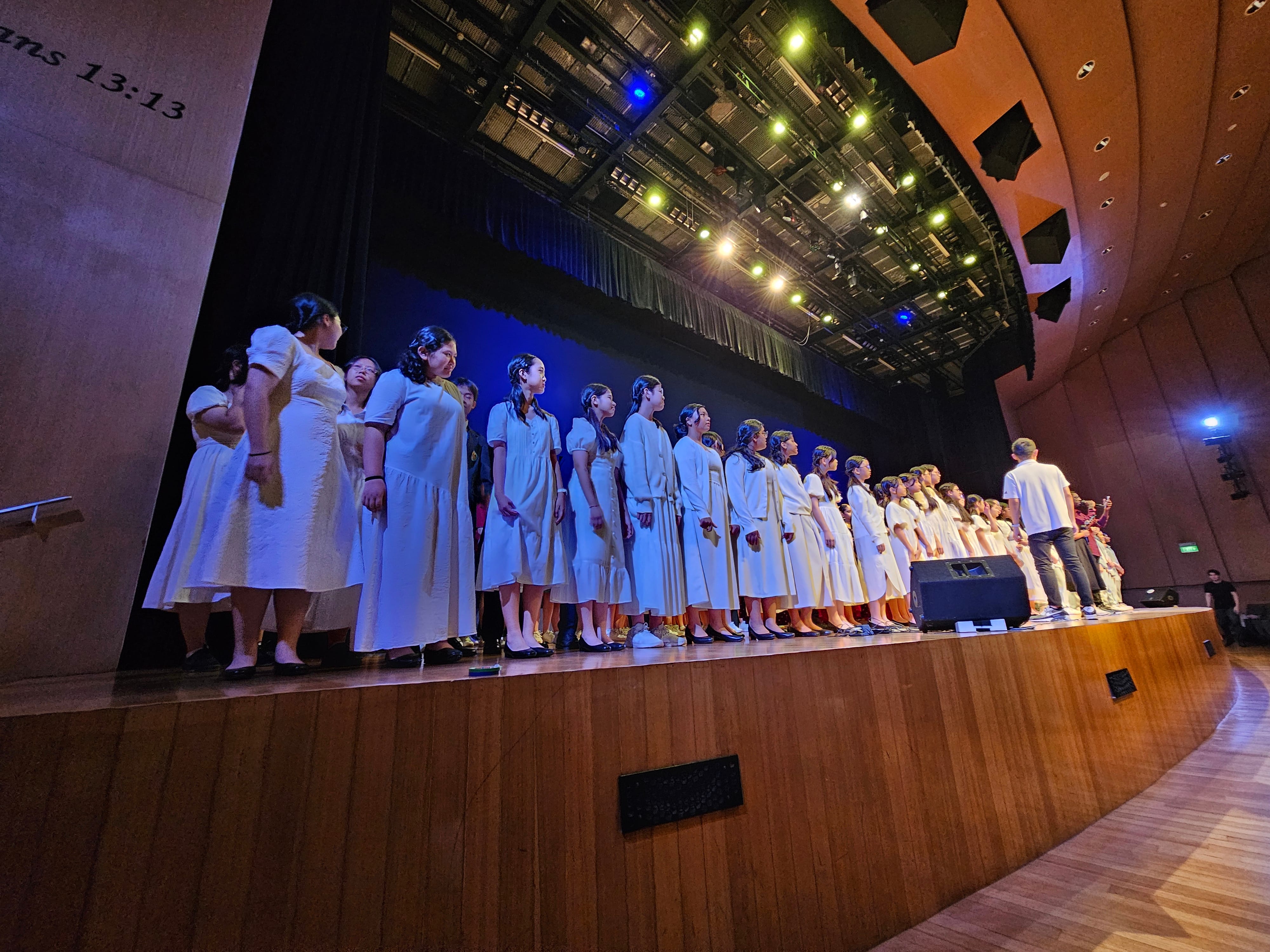 PSS Choir students rehearsing for a performance or Singapore Youth Festival