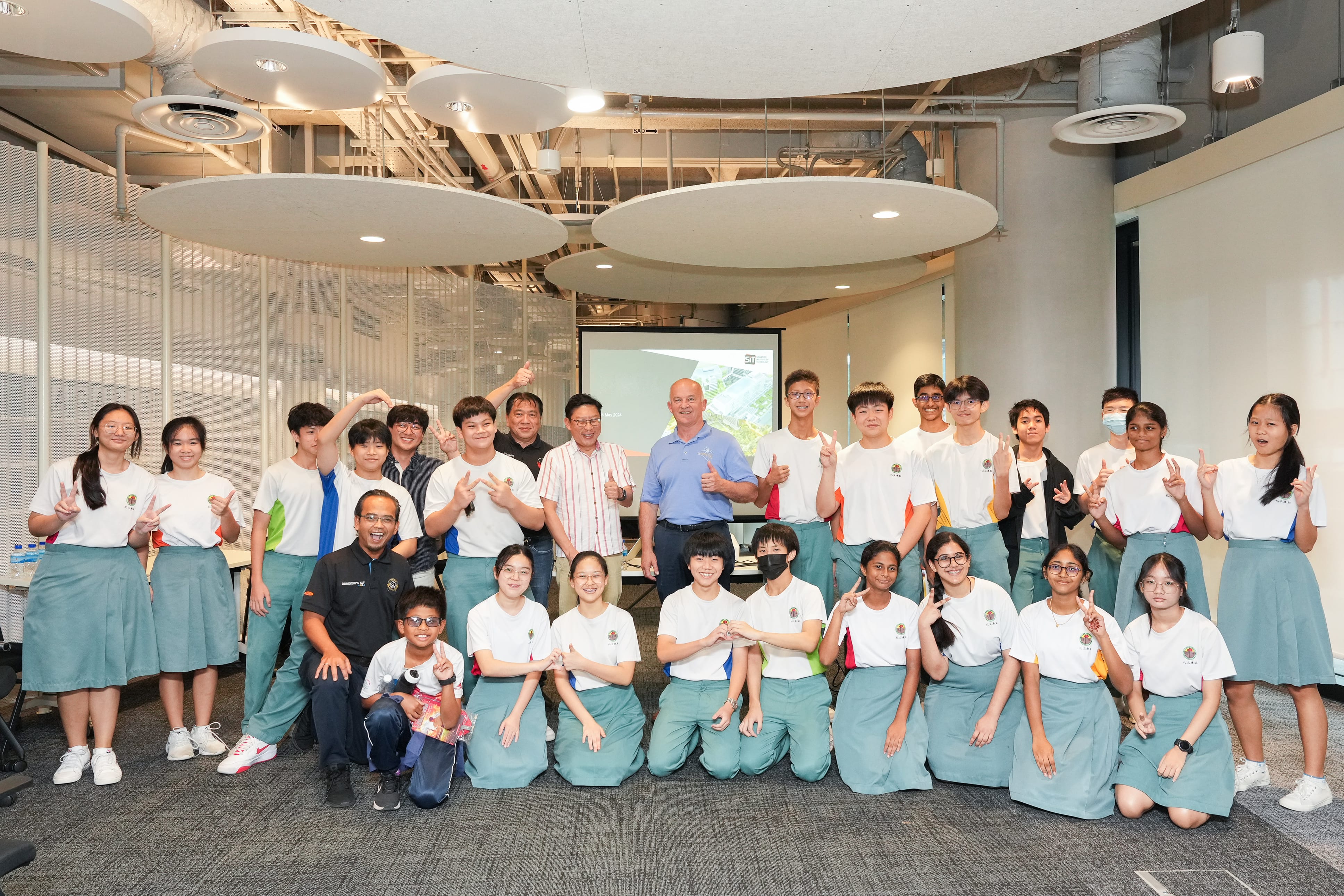 PSS students posing for a group photo with a NASA Ambassador during the Talent Development Programme