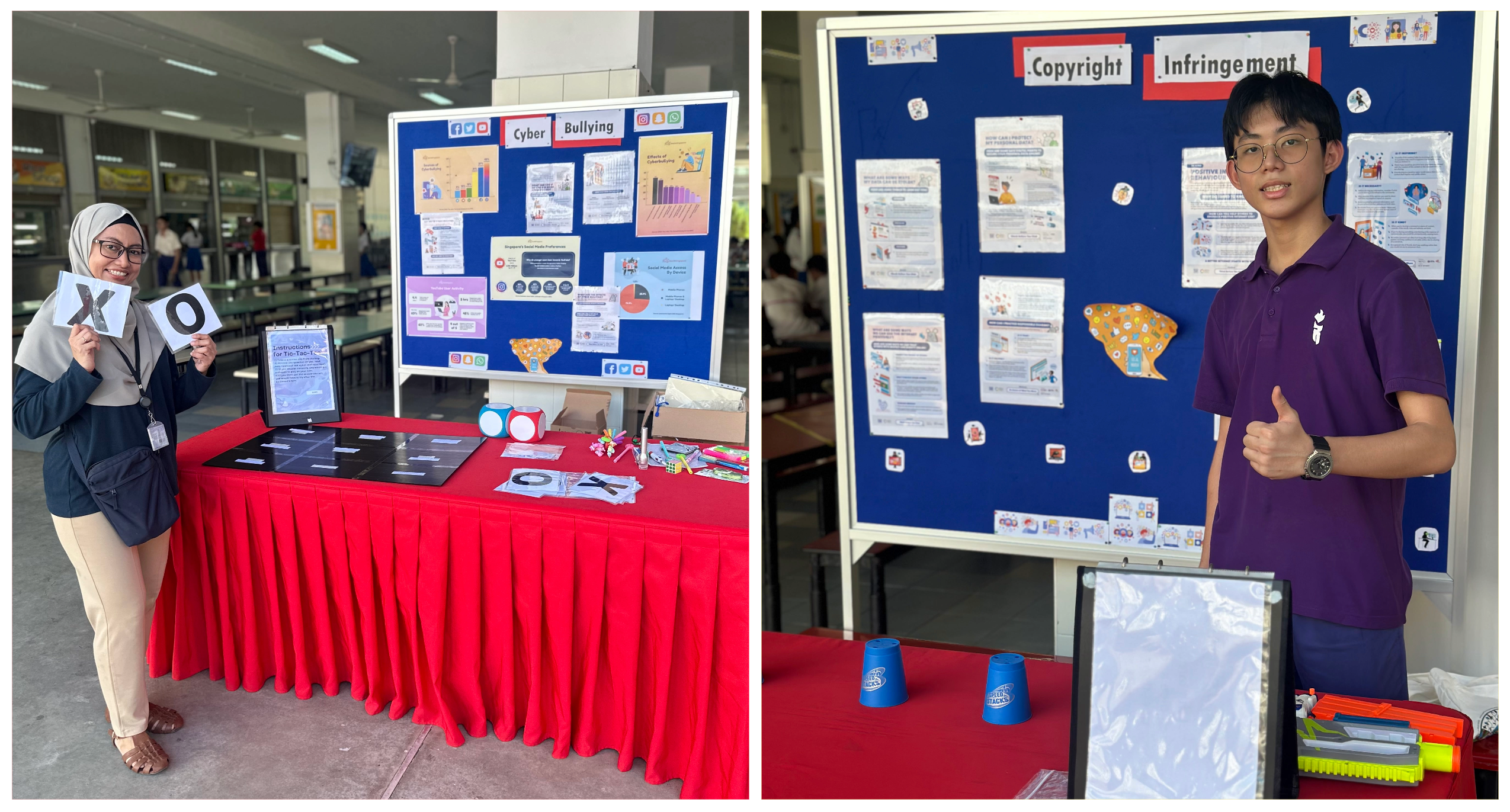 Two people pose by red tables with blue bulletin boards about cyberbullying and copyright infringement.