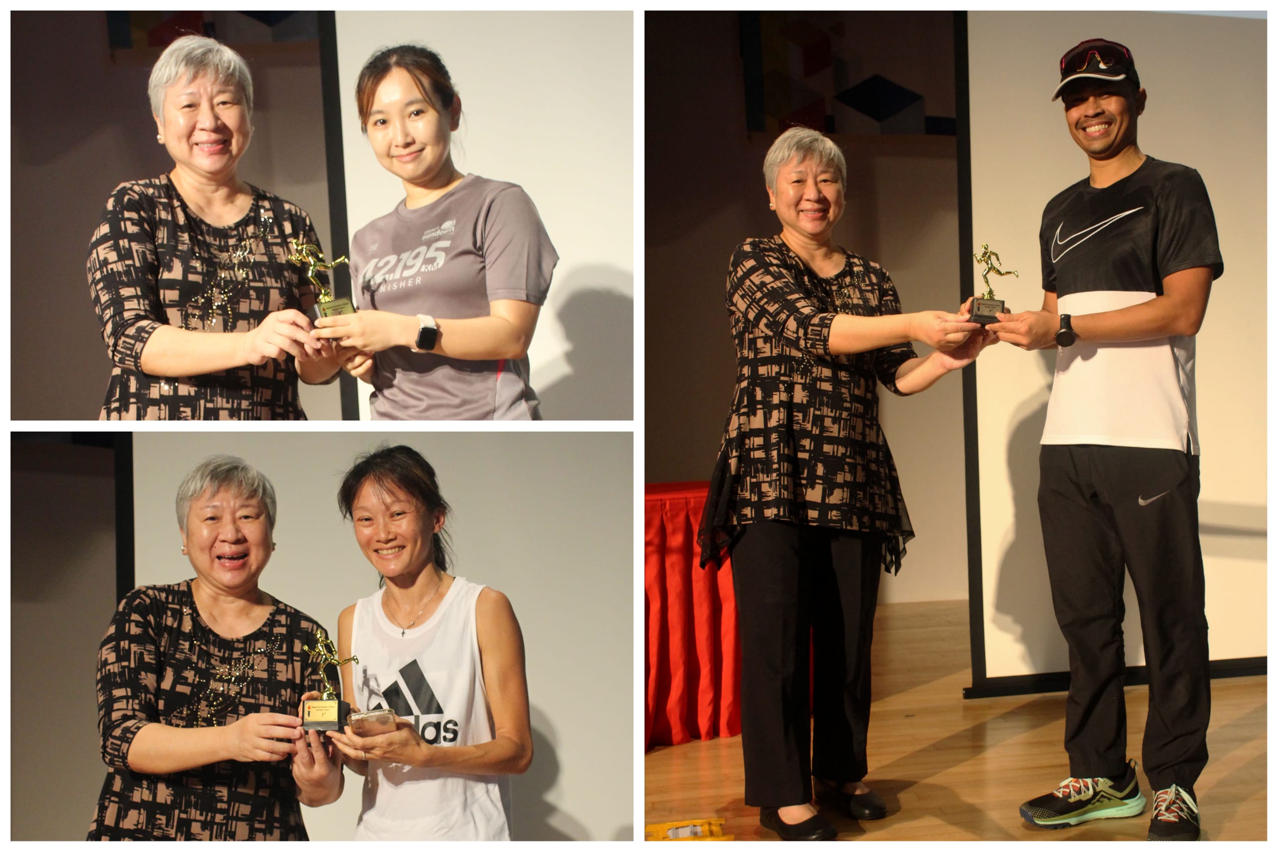 Three pairs of people smiling while presenting small gold trophies at an award ceremony indoors.