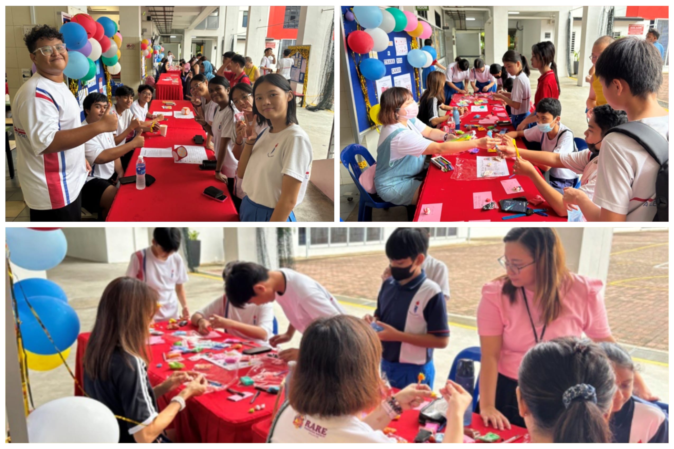 Students gather around red-clothed tables doing crafts at a school event decorated with colorful balloons.