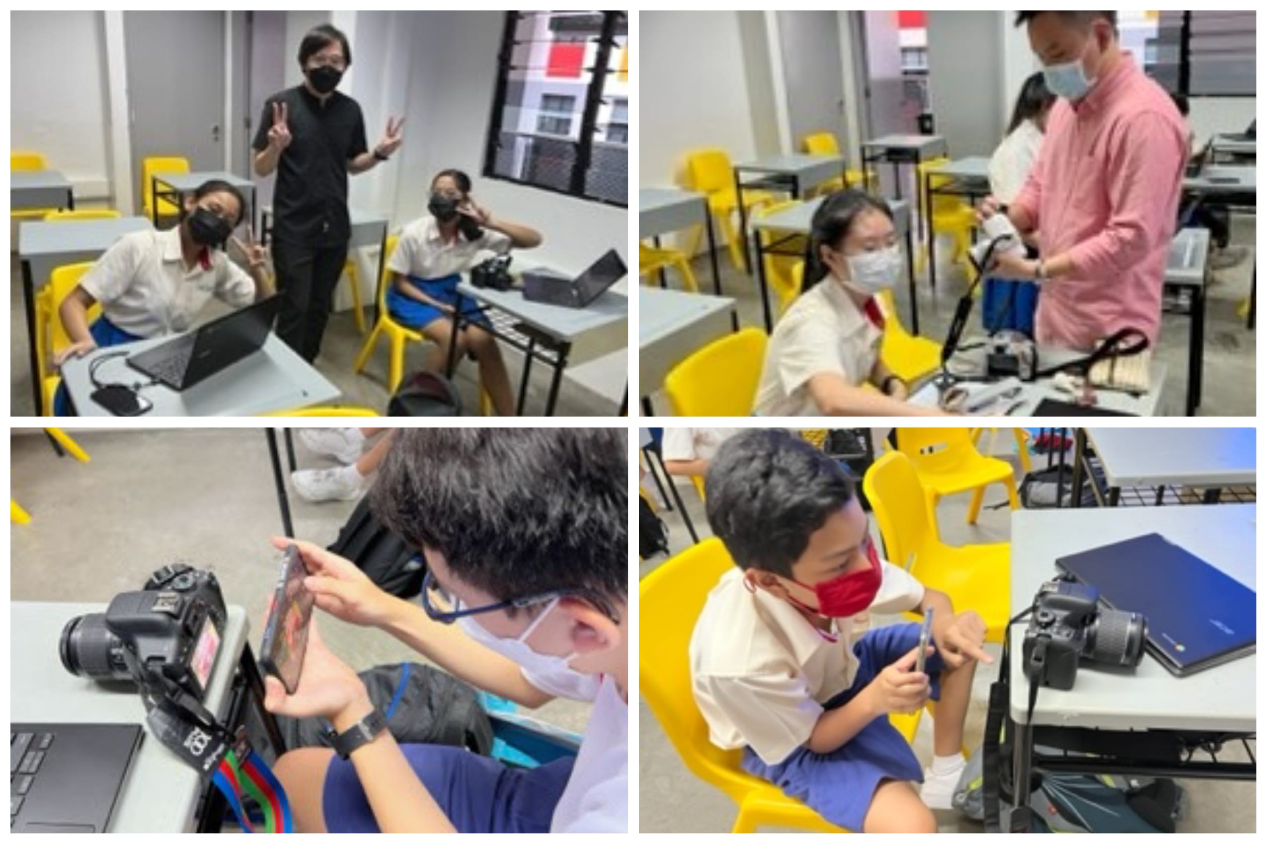 Students wearing masks in a classroom handle DSLR cameras and laptops while an adult instructor assists them.