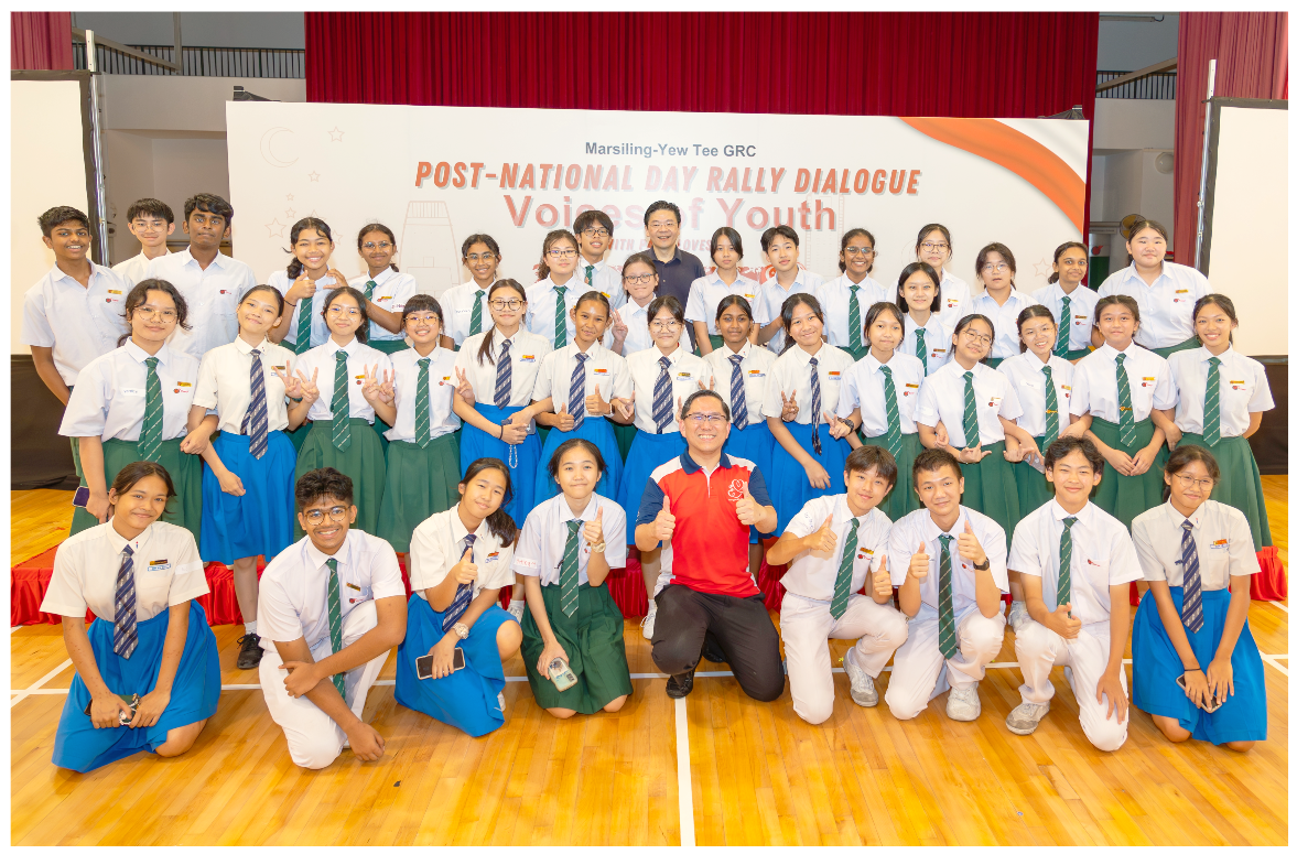 Group of uniformed students and two adults posing at a Marsiling-Yew Tee GRC Voices of Youth event.