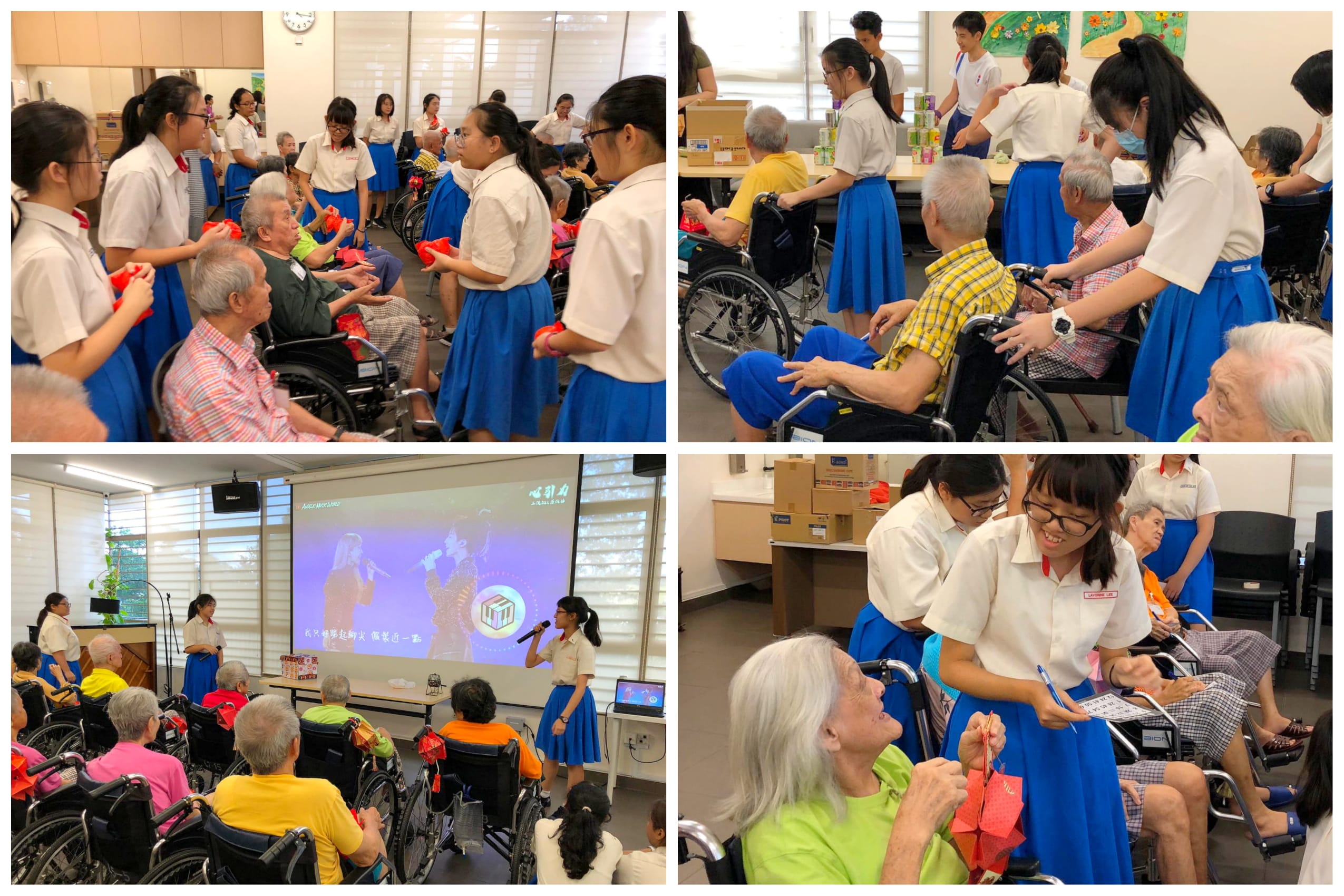 Students in blue skirts help elderly wheelchair users and lead a singalong in a community room.