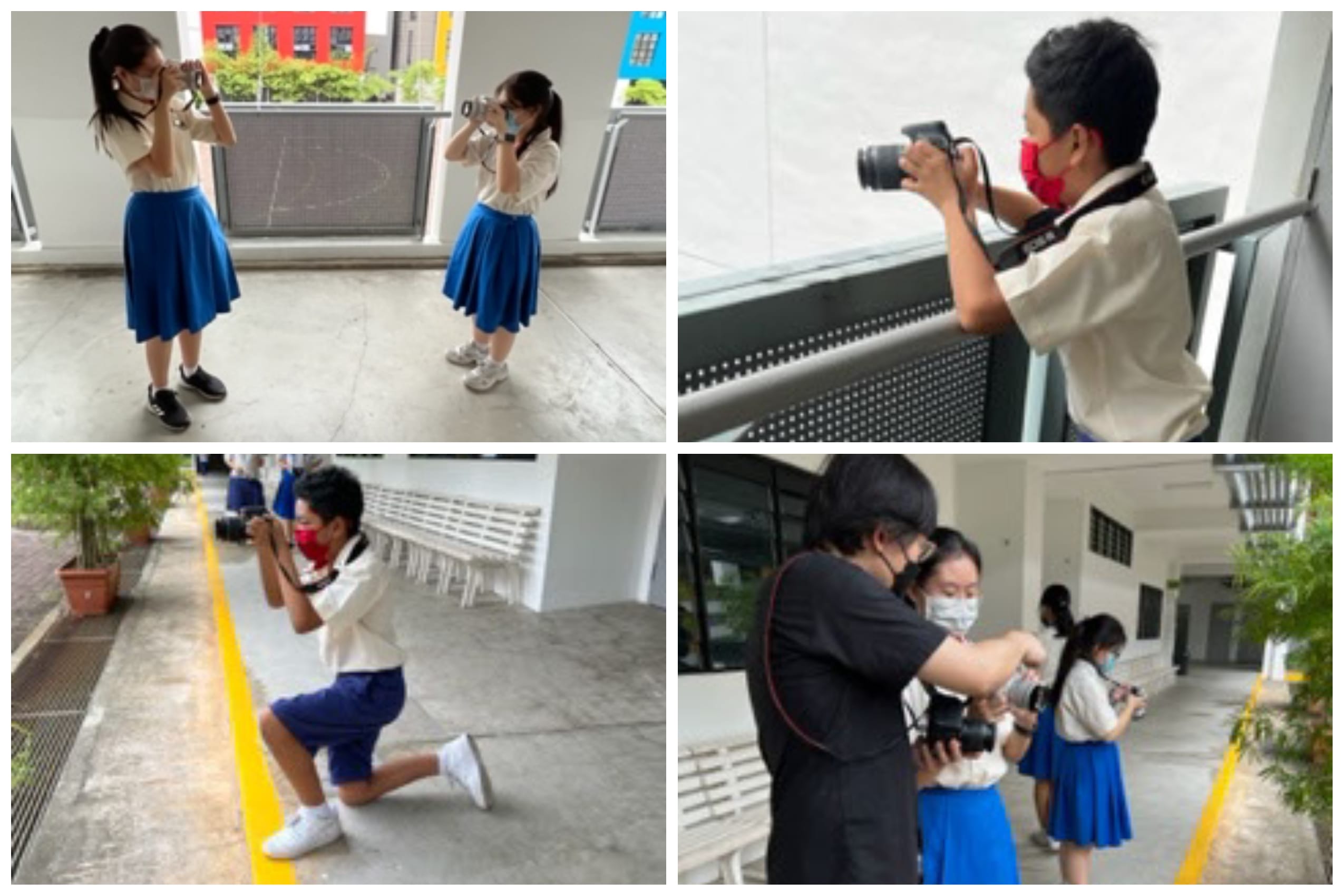 Four students in school uniforms and face masks practice photography with cameras outdoors at a school.