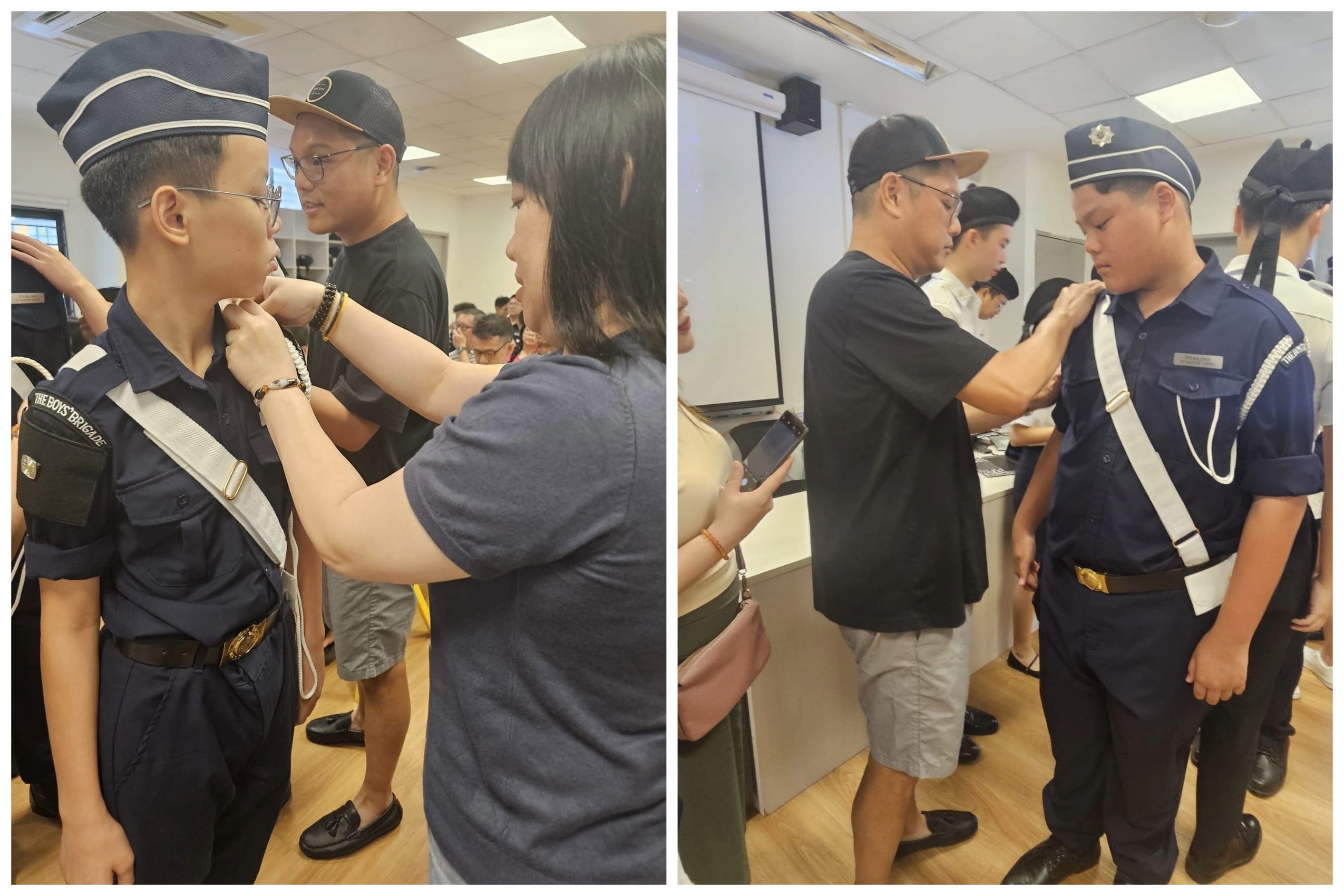 Adults pin badges onto Boys Brigade members in navy uniforms with white sashes and caps indoors.